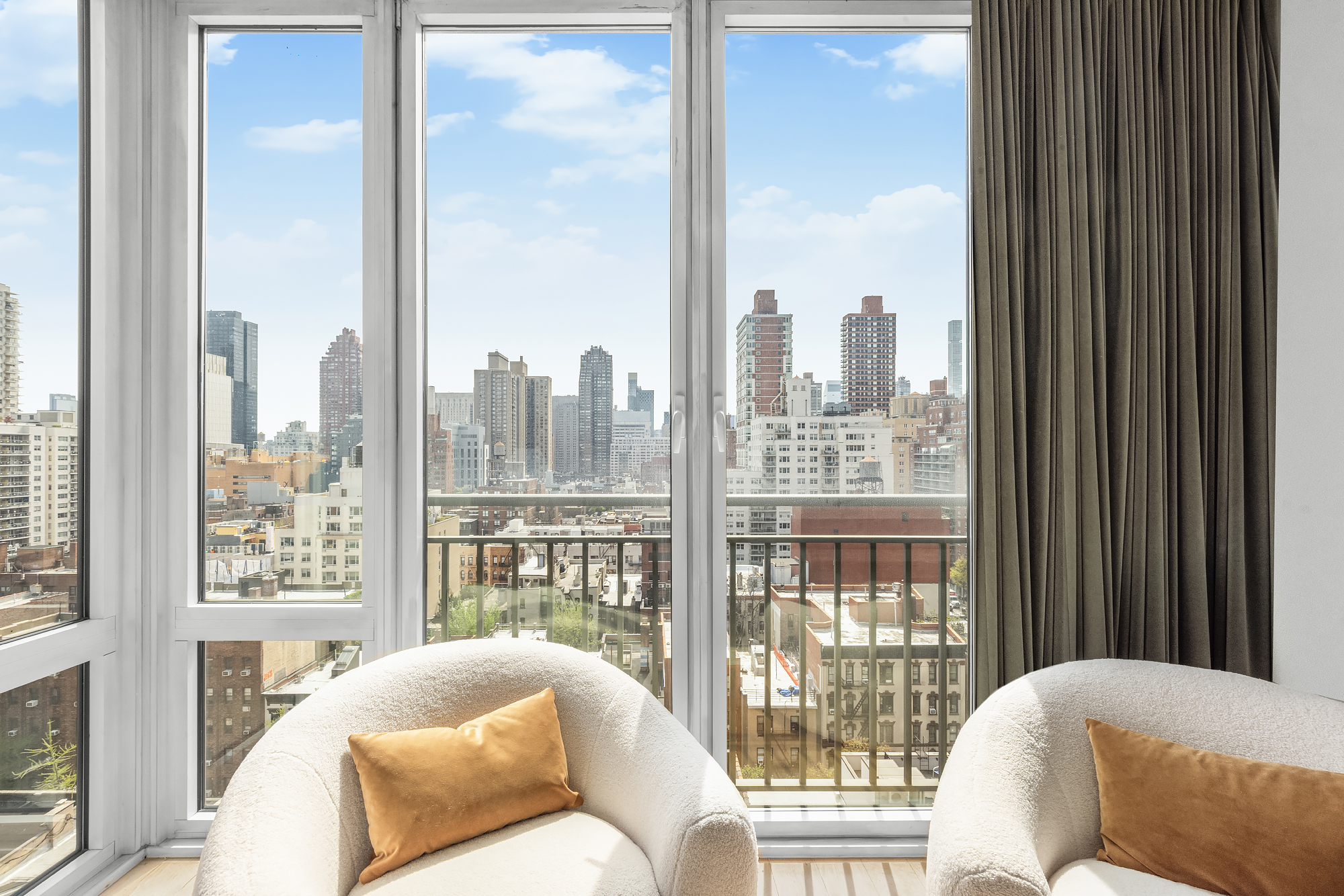 408 East 79th Street, Unit 14B Manhattan, NY 10075 - Photo 9 of 18 a bedroom with furniture and a large window