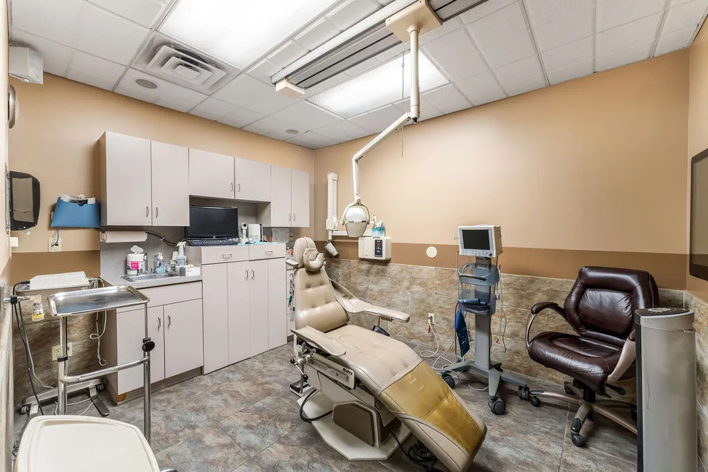 a work room with furniture and gym equipment