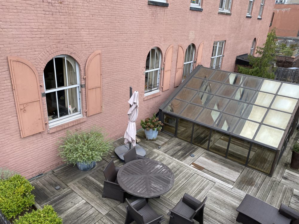 105 Hudson Street, Unit 307 Manhattan, NY 10013 - Photo 4 of 4 a front view of a house with outdoor seating