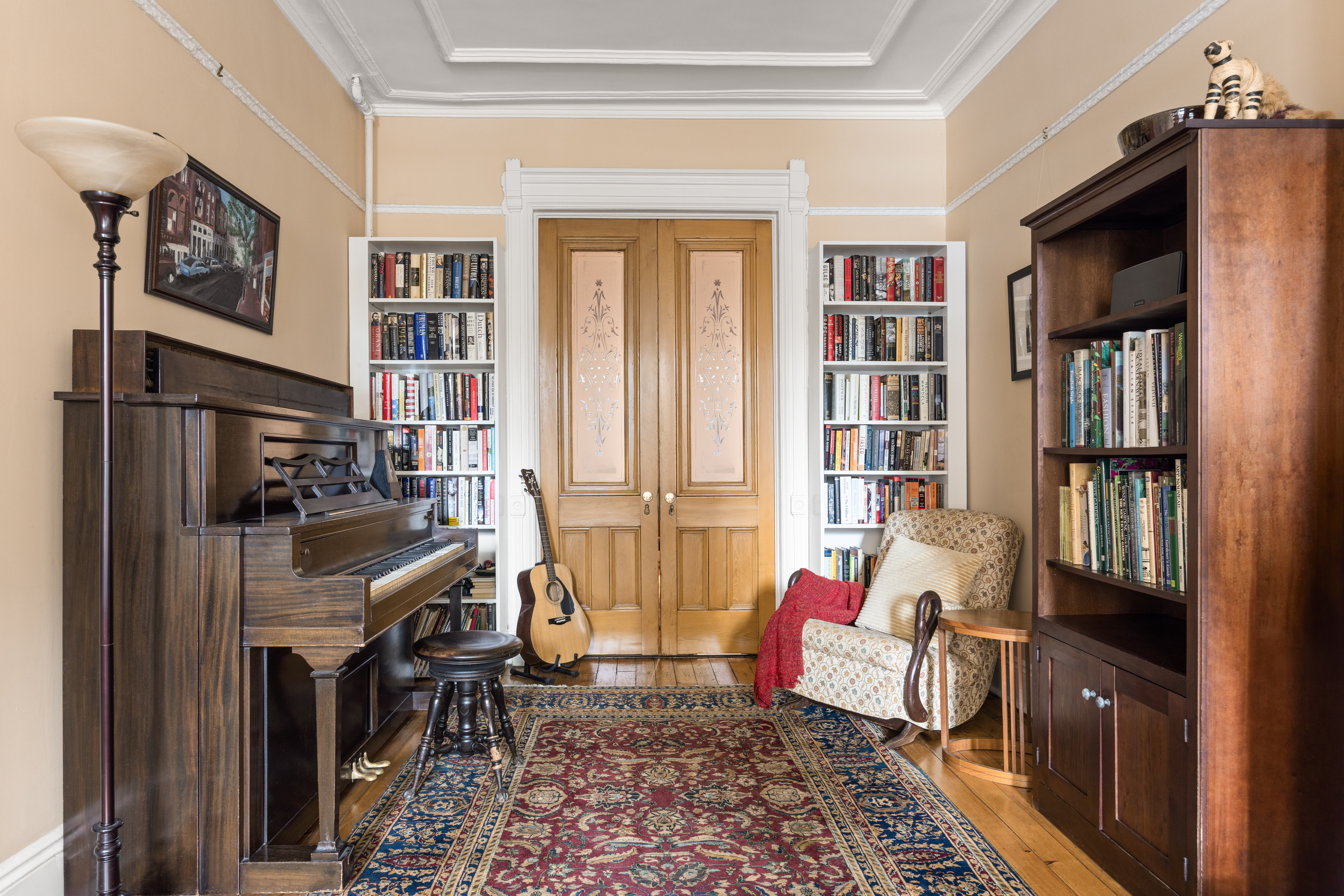 482 11th Street Brooklyn, NY 11215 - Photo 5 of 24 a bedroom with furniture and a book shelf