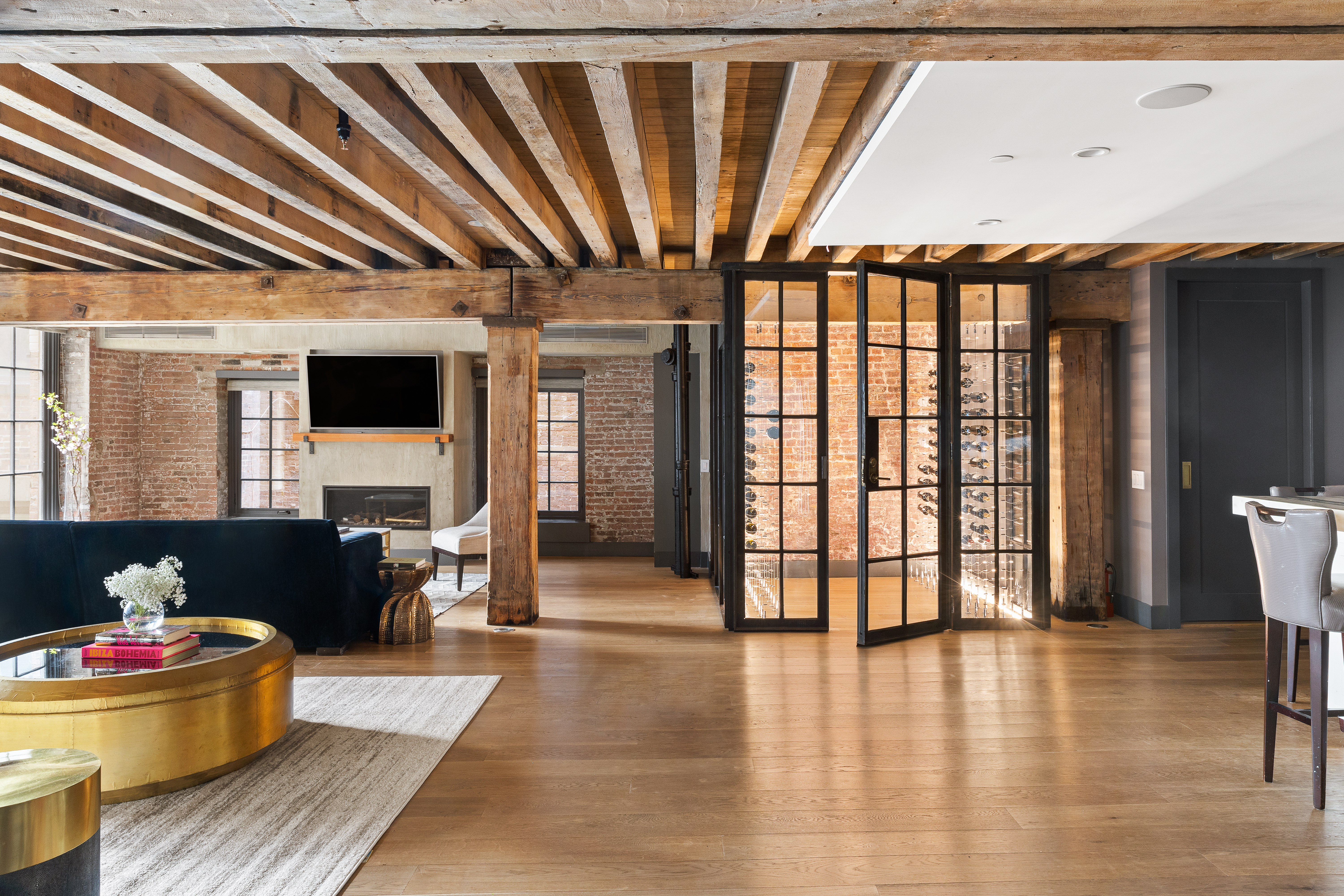 466 Washington Street, Unit 3W Manhattan, NY 10013 - Photo 5 of 14 a living room with furniture and a flat screen tv