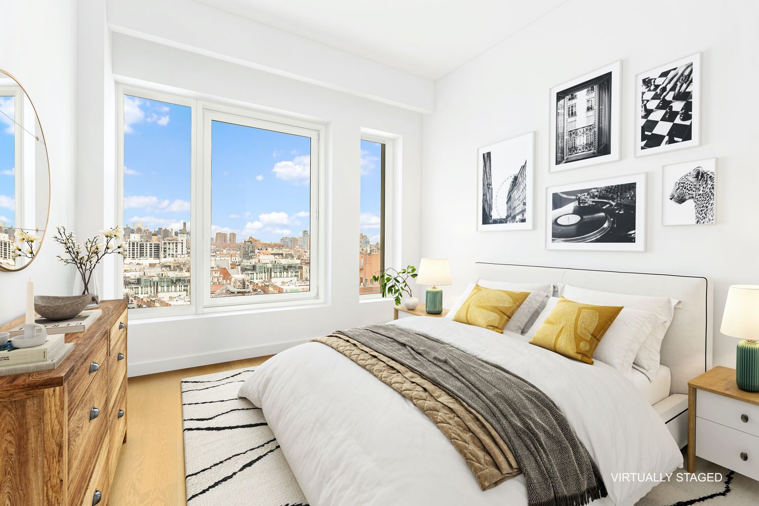 a bedroom with a large bed and a large window