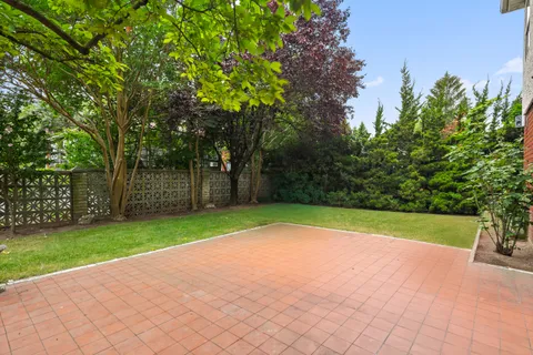 an aerial view of residential houses with city view