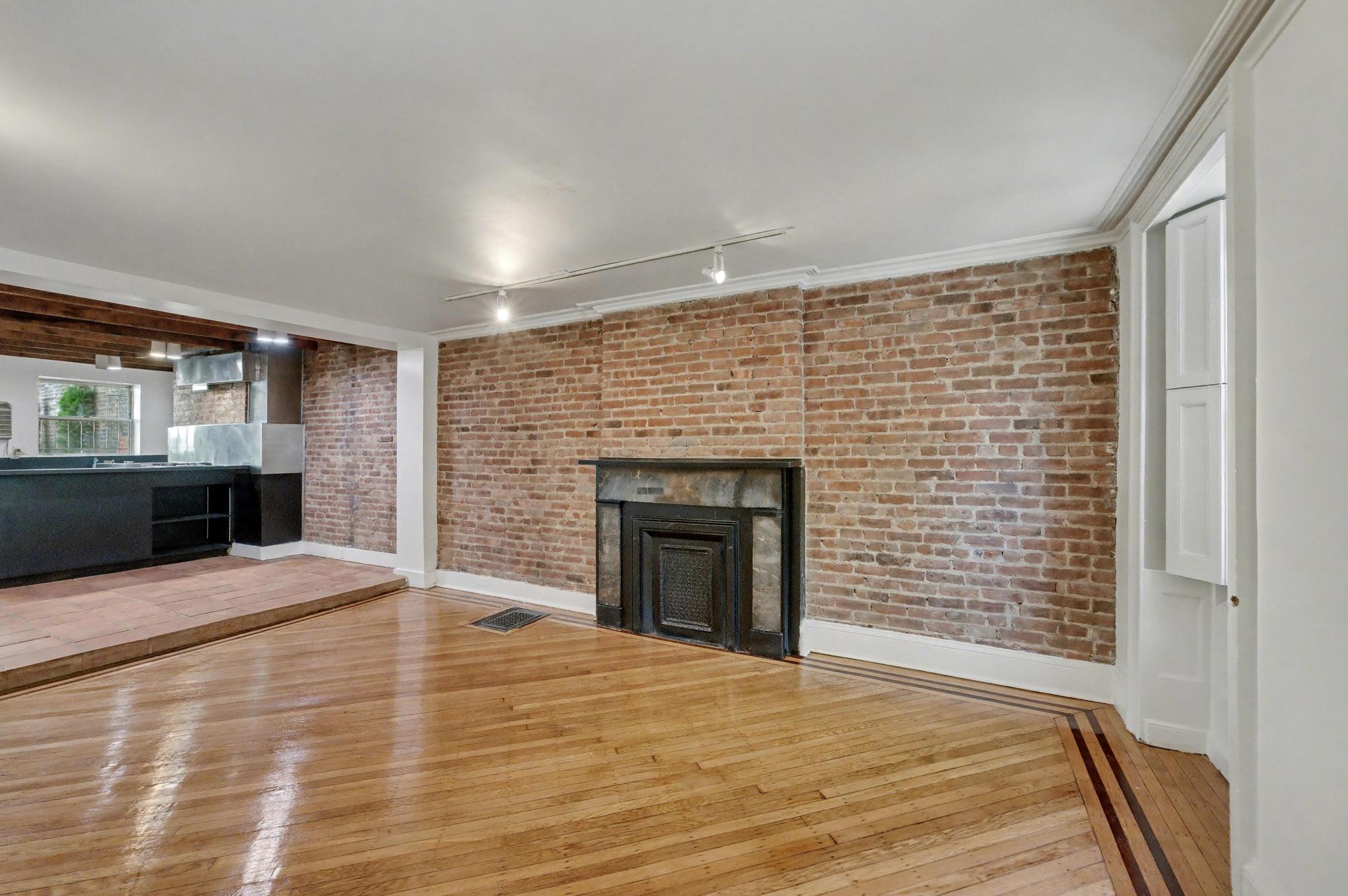 39 Schermerhorn Street Brooklyn, NY 11201 - Photo 8 of 16 a view of an empty room with a fireplace and a window