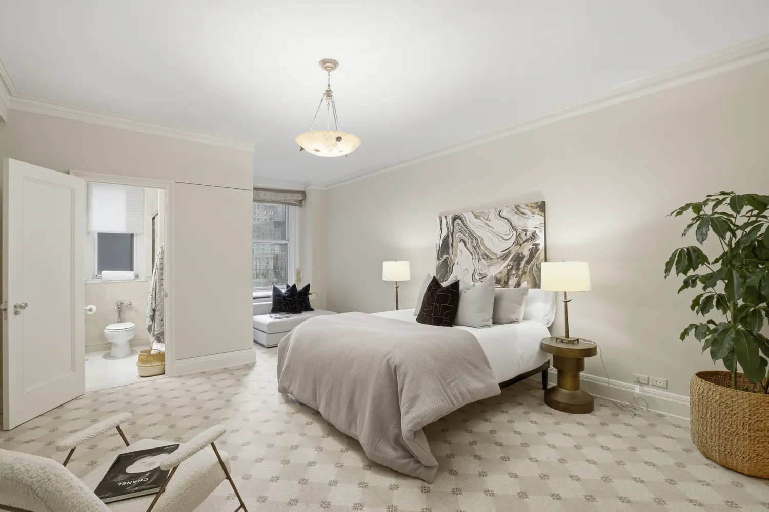 a bedroom with a bed and potted plant