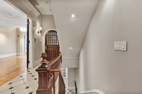 a view of staircase with wooden floor