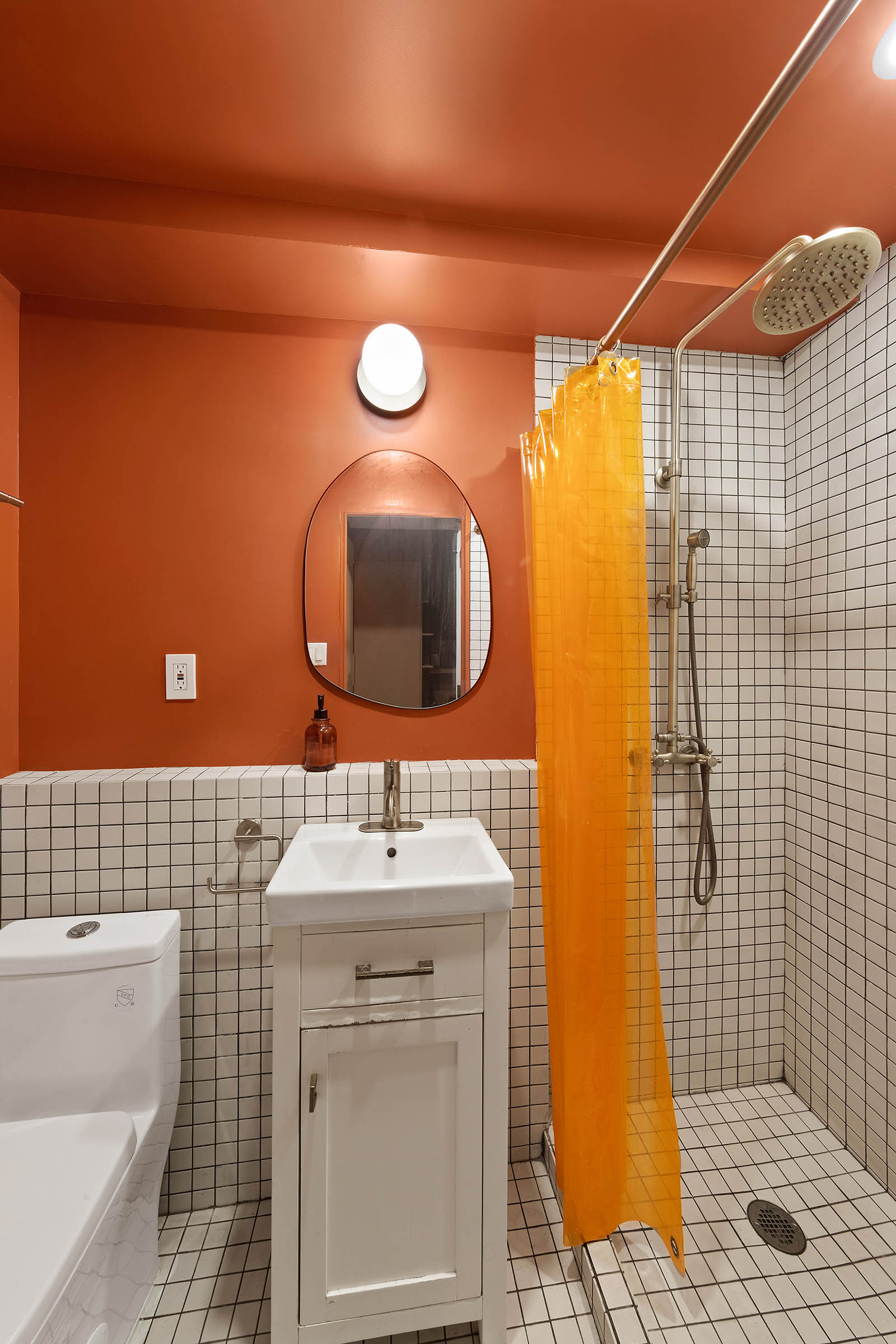 209 Onderdonk Avenue Queens, NY 11385 - Photo 13 of 16 a bathroom with a sink toilet and shower
