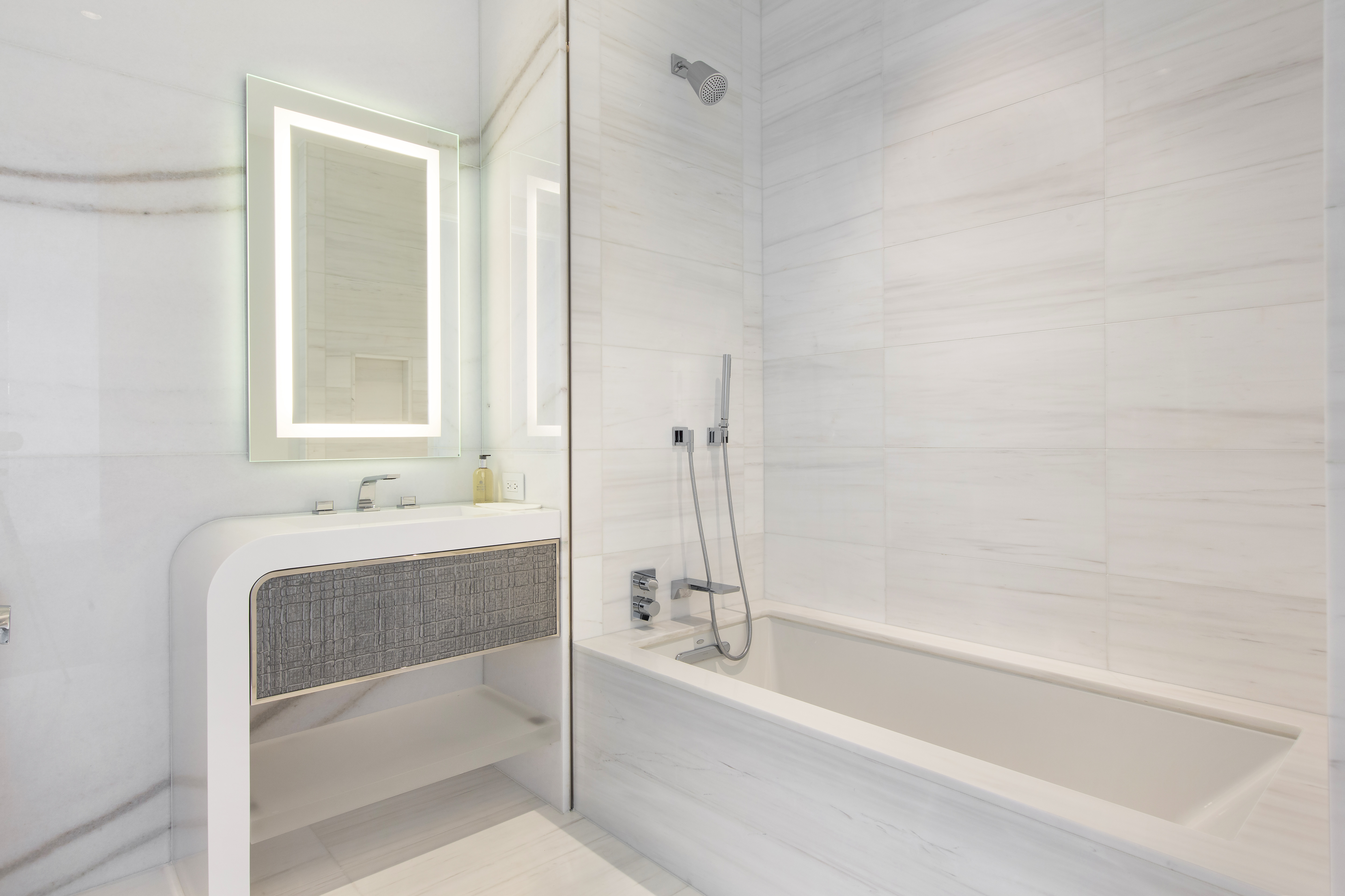 35 Hudson Yards, Unit 5805 Manhattan, NY 10001 - Photo 9 of 19 a bathroom with a bathtub and a sink