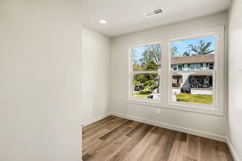 a view of an empty room and a window