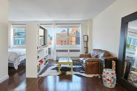 a room with furniture and a window