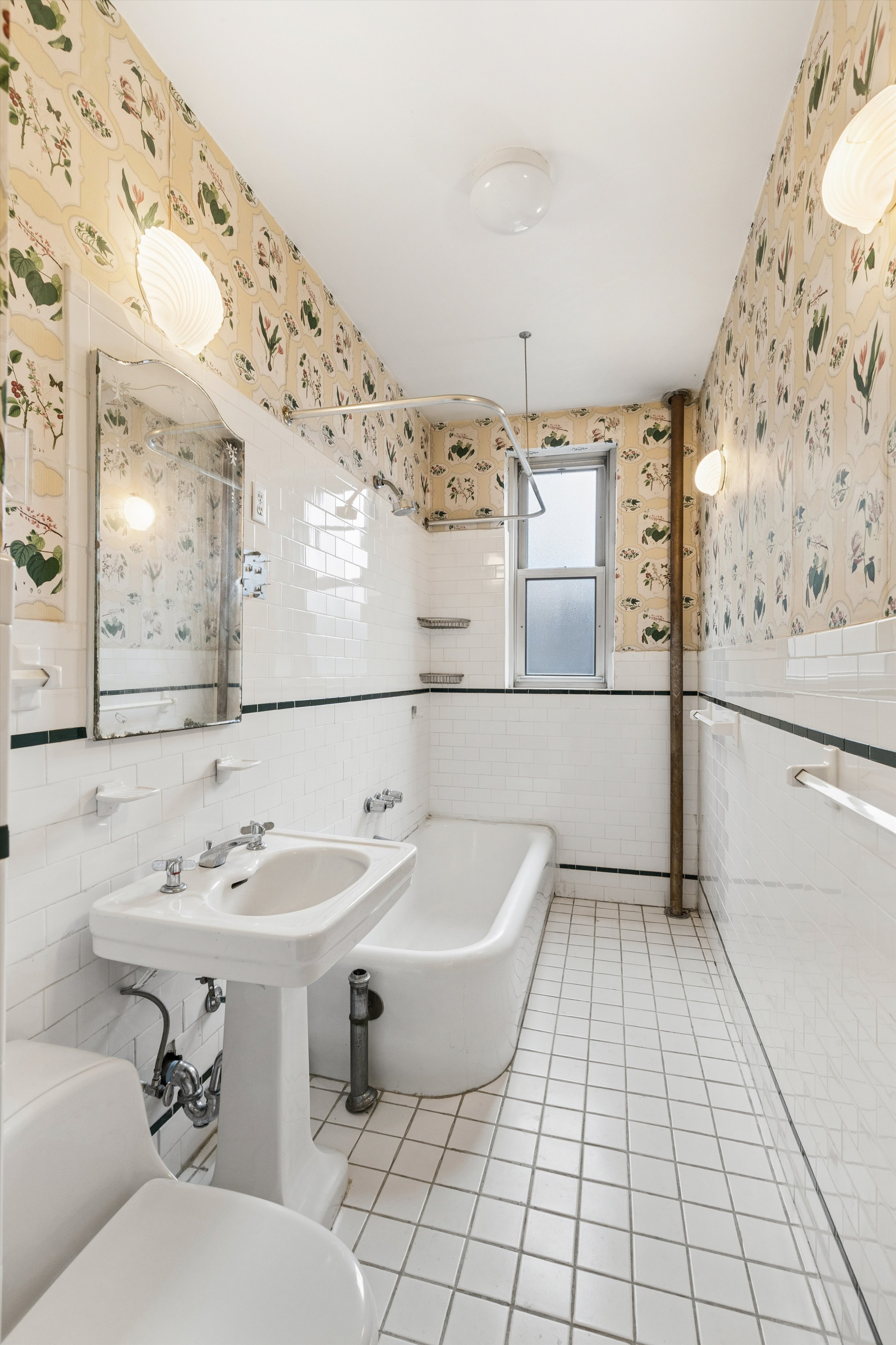 17 East 97th Street, Unit 5A Manhattan, NY 10029 - Photo 20 of 25 a bathroom with a sink toilet and mirror