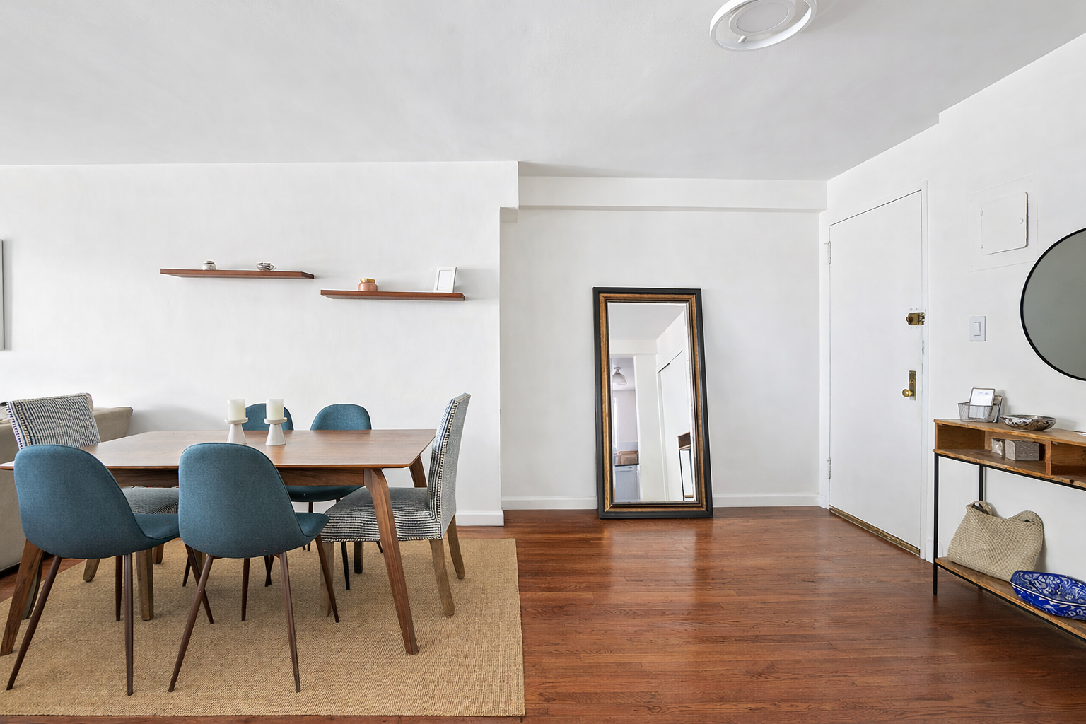 165 Christopher Street, Unit 5Y Manhattan, NY 10014 - Photo 6 of 9 a view of a dining room with furniture and wooden floor