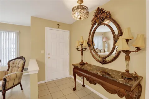 a view of a livingroom with furniture and a mirror