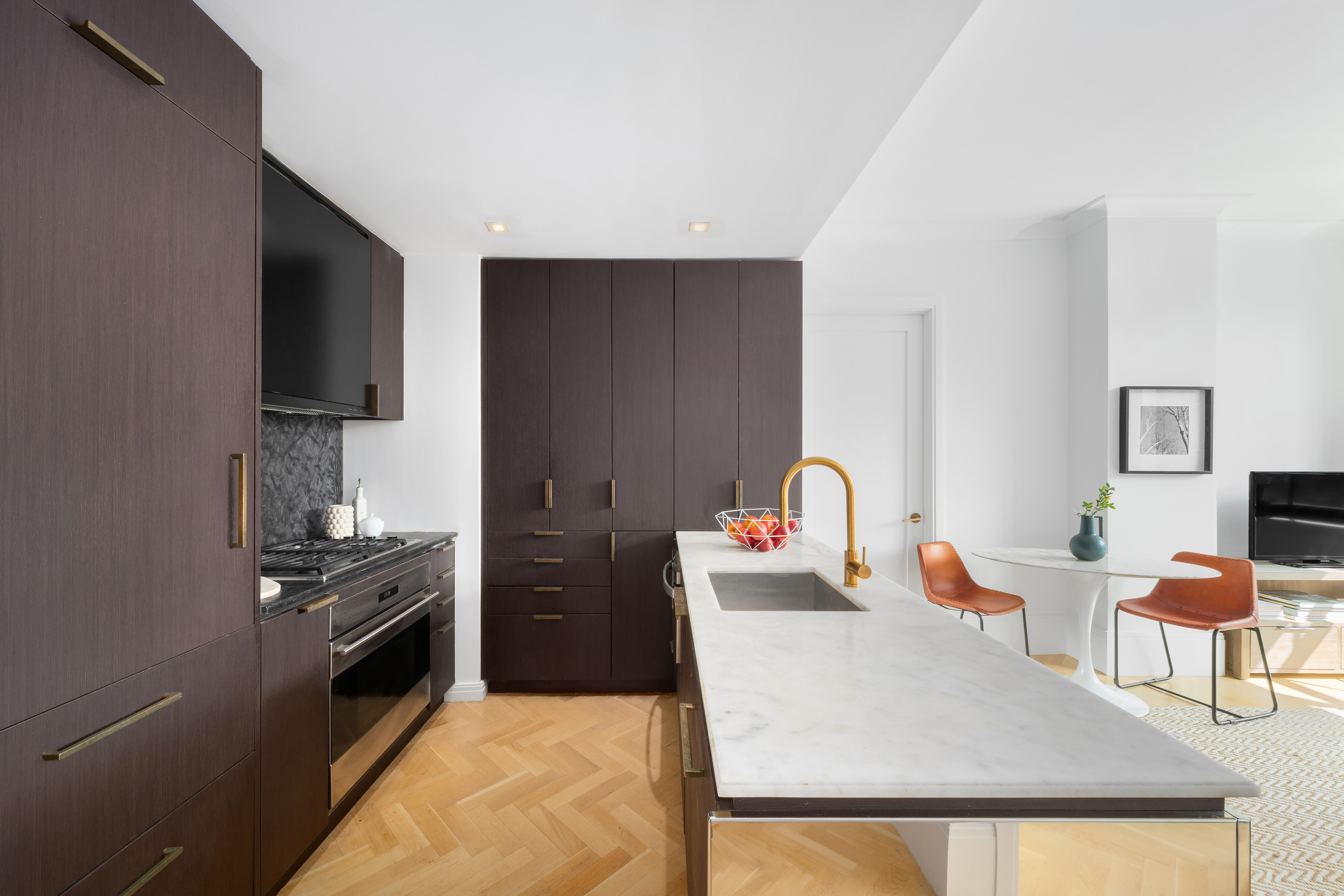 50 Clinton Street, Unit 4A Manhattan, NY 10002 - Photo 2 of 12 a kitchen with stainless steel appliances granite countertop a stove a sink dishwasher and a refrigerator with wooden floor