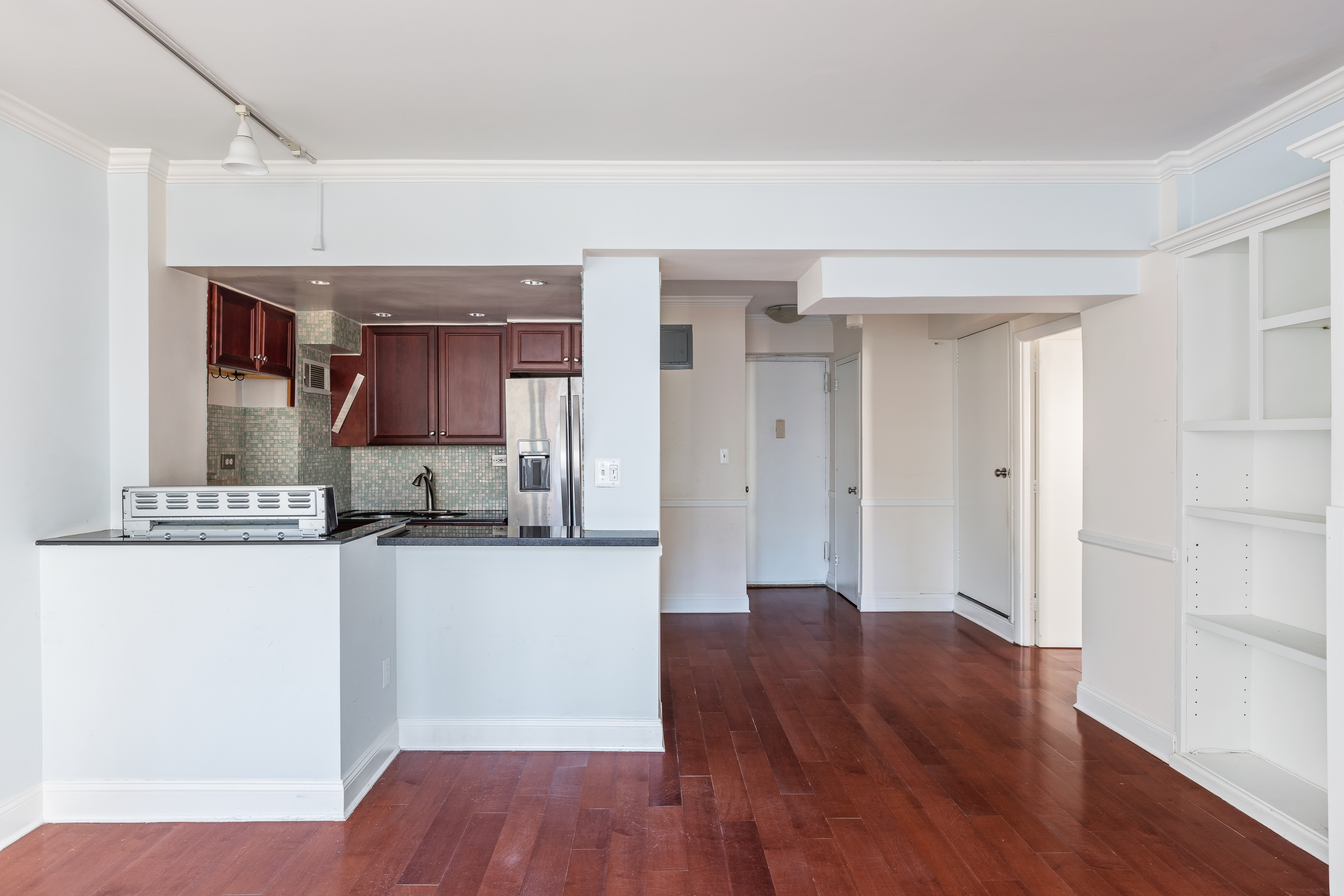 210 East 36th Street, Unit PHC Manhattan, NY 10016 - Photo 4 of 15 a view of a kitchen cabinets and wooden floor