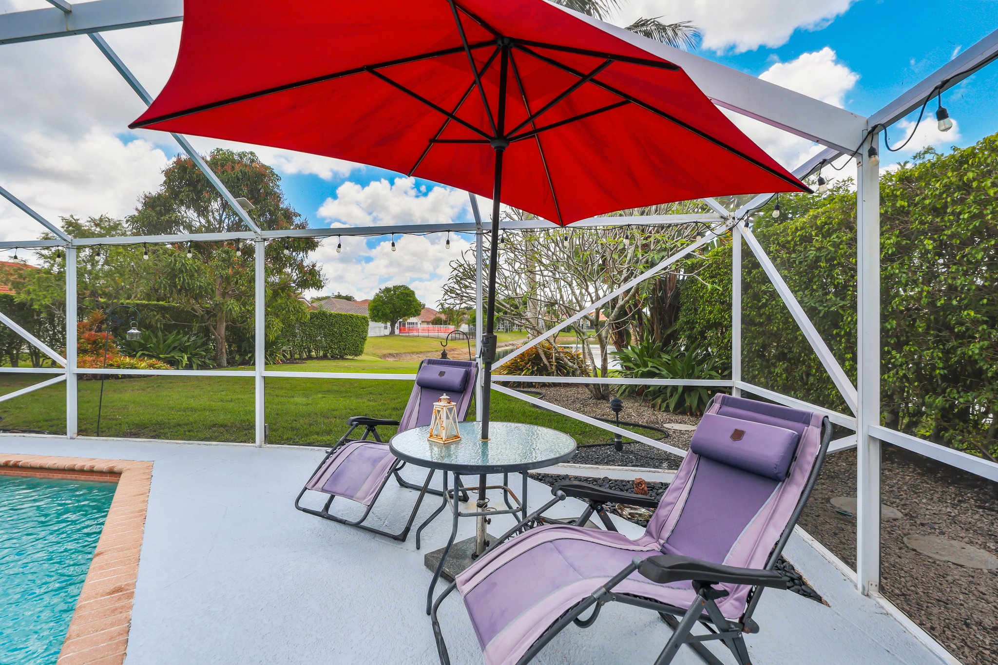 20317 Hacienda Court Boca Raton, FL 33498 - Photo 44 of 100 a view of an outdoor sitting area with a backyard