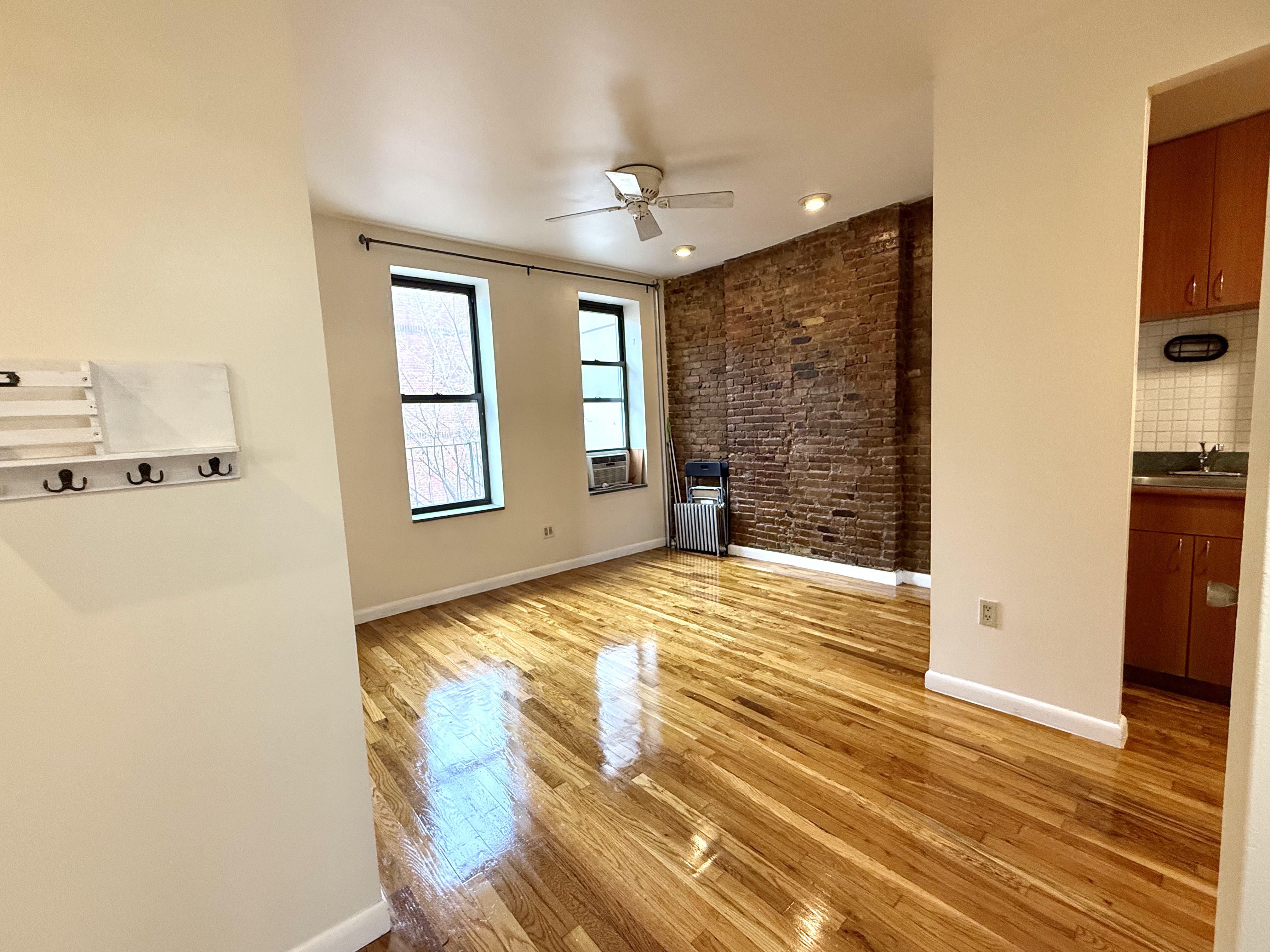 Park Avenue Manhattan, NY 10035 - Photo 2 of 14 a view of empty room with wooden floor