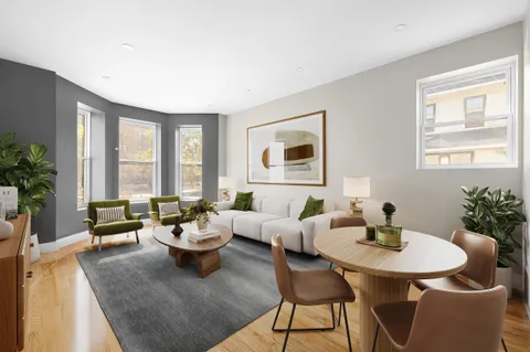 a living room with furniture and window