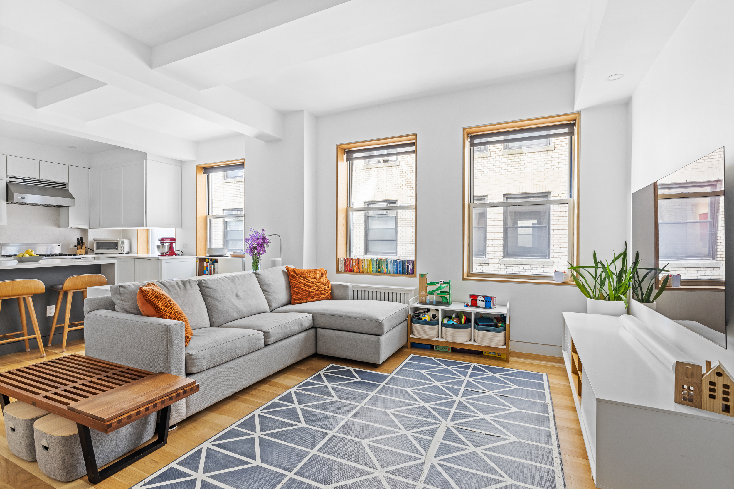 240 West 98th Street, Unit 8D Manhattan, NY 10025 - Photo 2 of 12 a living room with furniture and a window