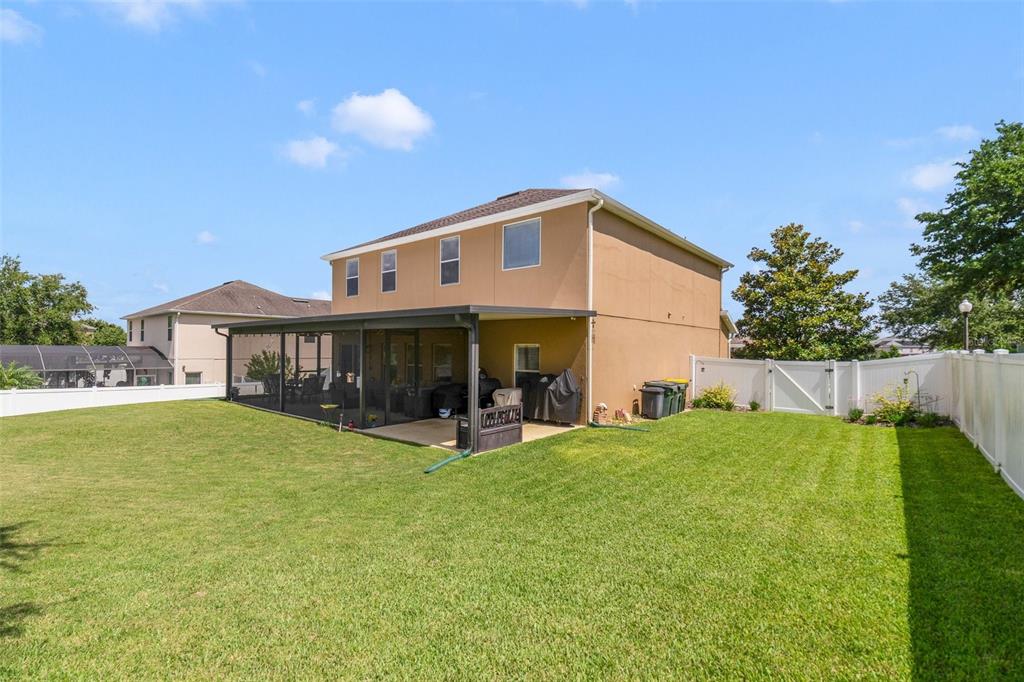 352 Giovani Boulevard Clermont, FL 34715 - Photo 46 of 46 a view of a house with a yard and sitting area
