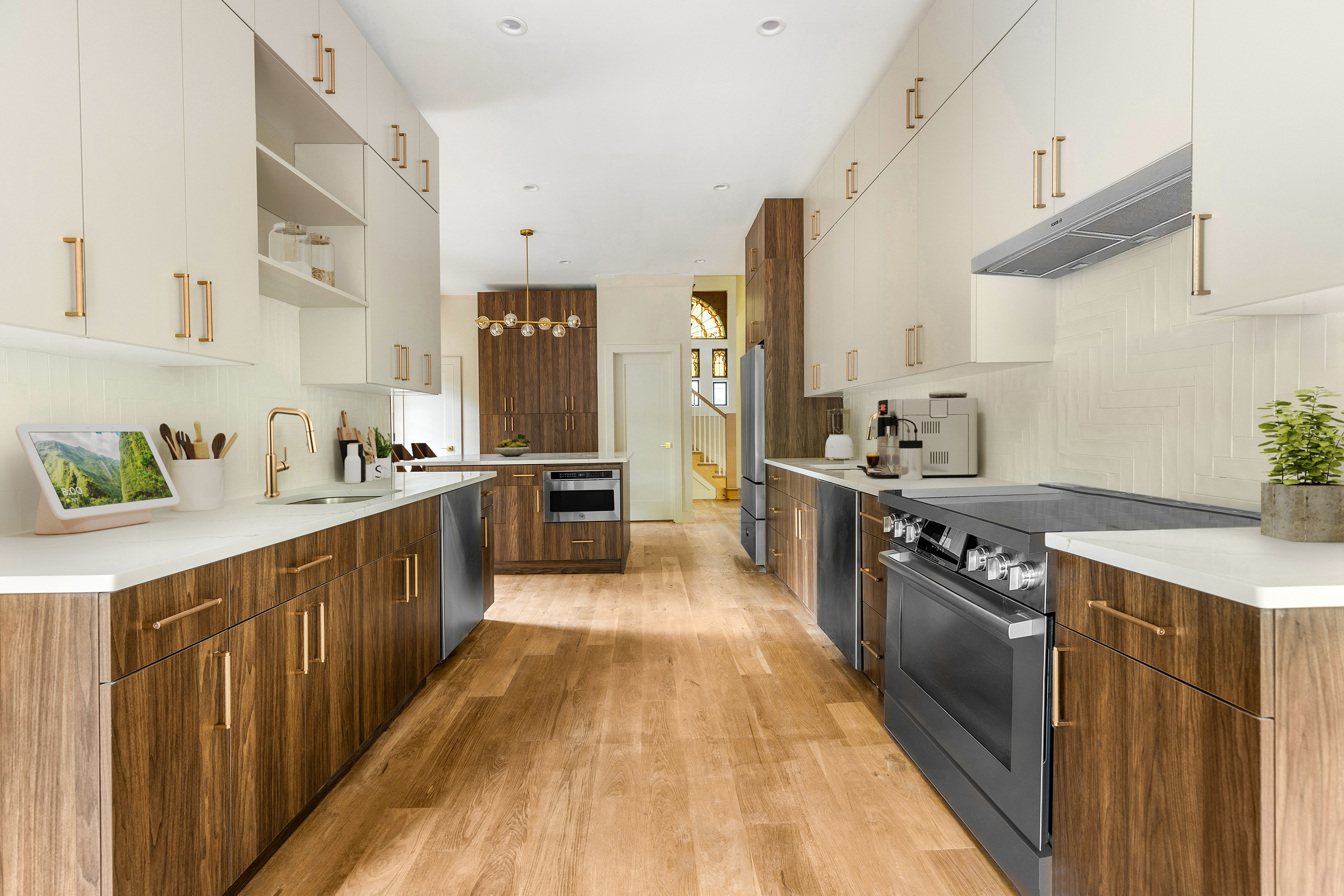 695 East 21st Street Brooklyn, NY 11210 - Photo 4 of 24 a kitchen with stainless steel appliances a sink and a counter