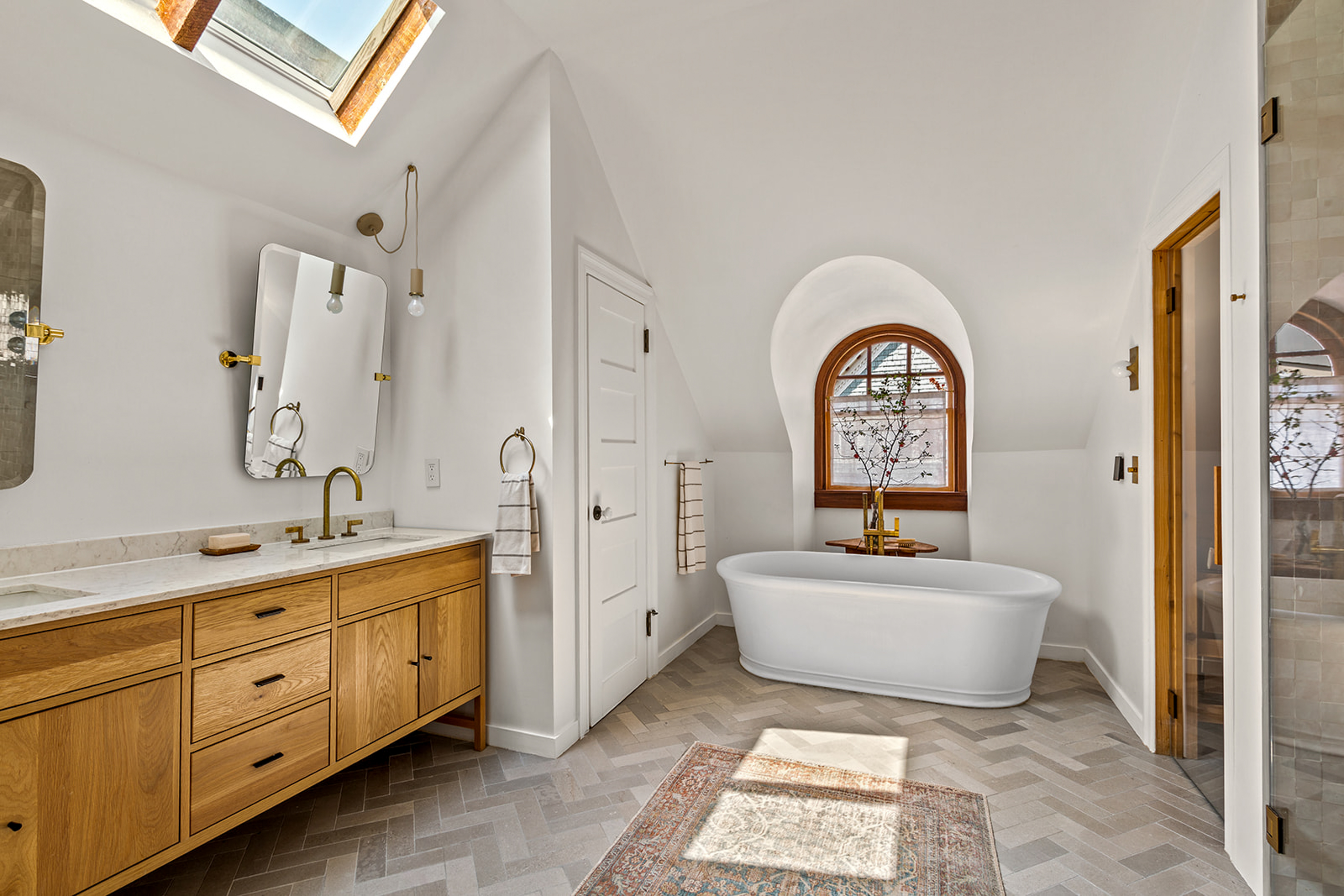 1221 Albemarle Road Brooklyn, NY 11218 - Photo 38 of 45 a spacious bathroom with a double vanity sink a mirror and a bathtub