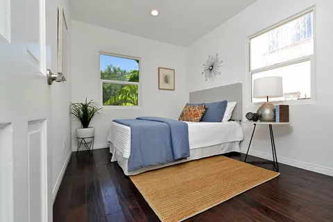 a bedroom with a bed and a couch