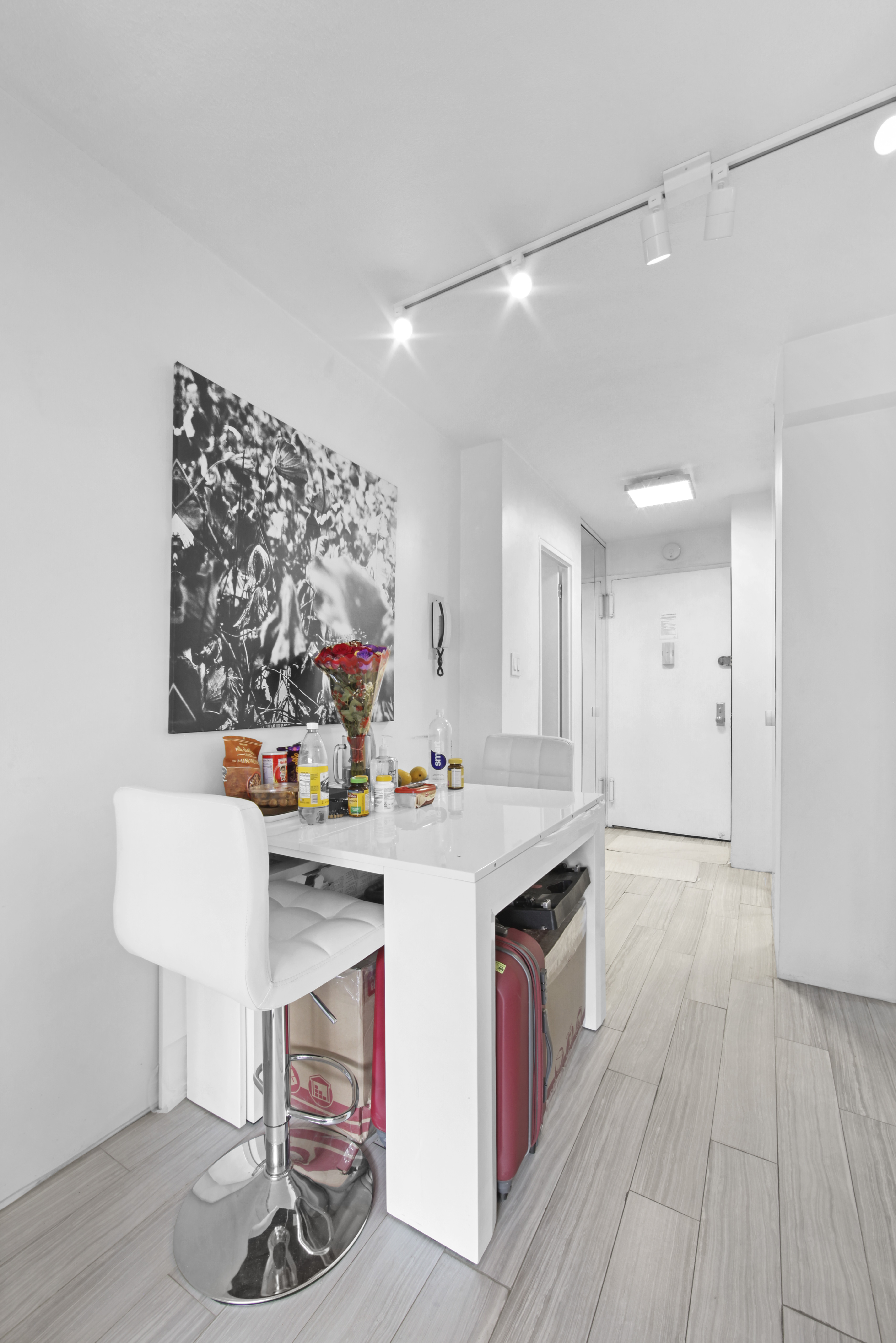 220 East 60th Street, Unit 5F Manhattan, NY 10022 - Photo 4 of 8 a kitchen with stainless steel appliances a stove a sink dishwasher and a refrigerator