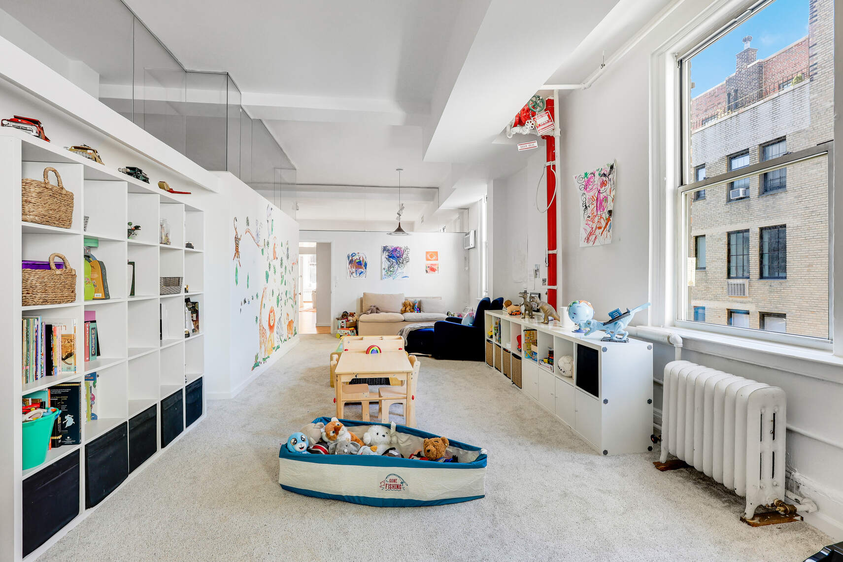 35 East 12th Street, Unit 8C Manhattan, NY 10003 - Photo 9 of 22 a living room with furniture and a couch