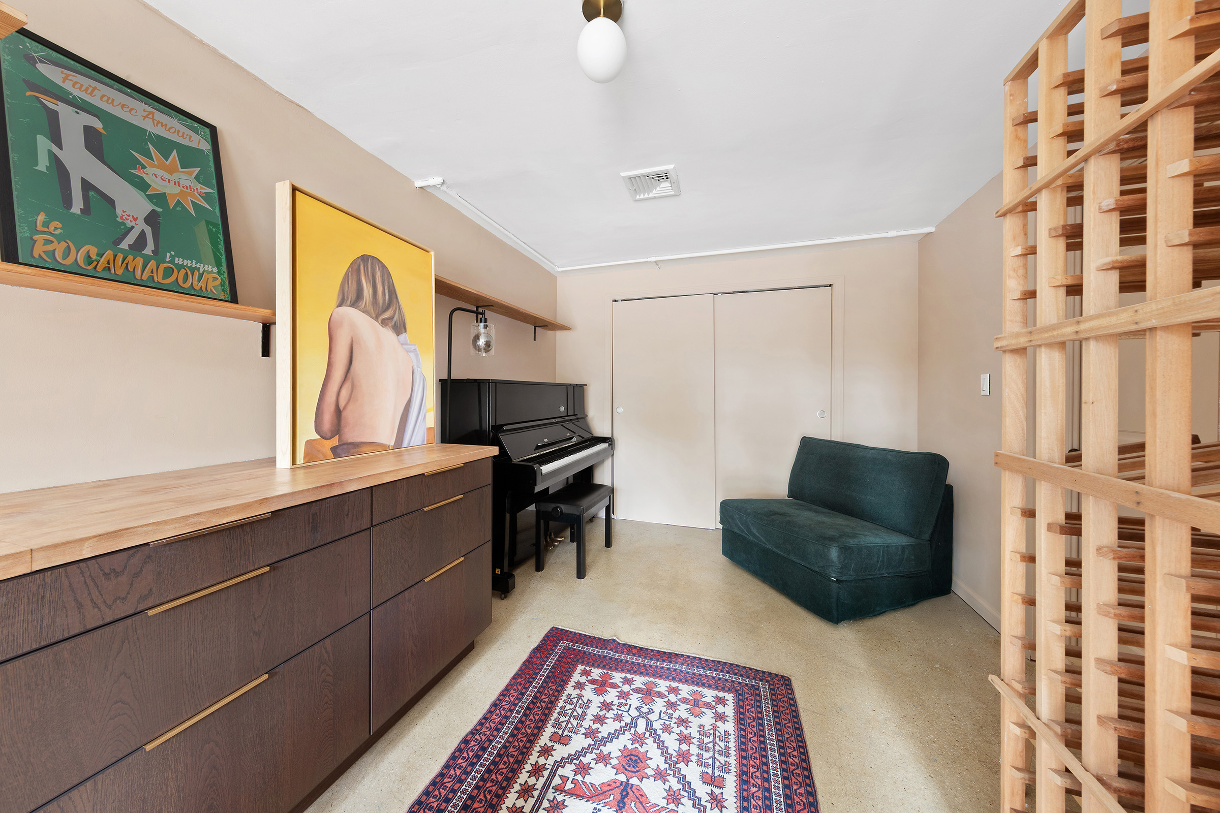 209 Onderdonk Avenue Queens, NY 11385 - Photo 11 of 16 a living room with furniture and a window