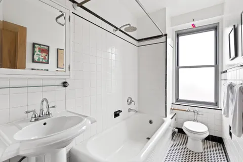 a bathroom with a sink toilet a shower and bathtub