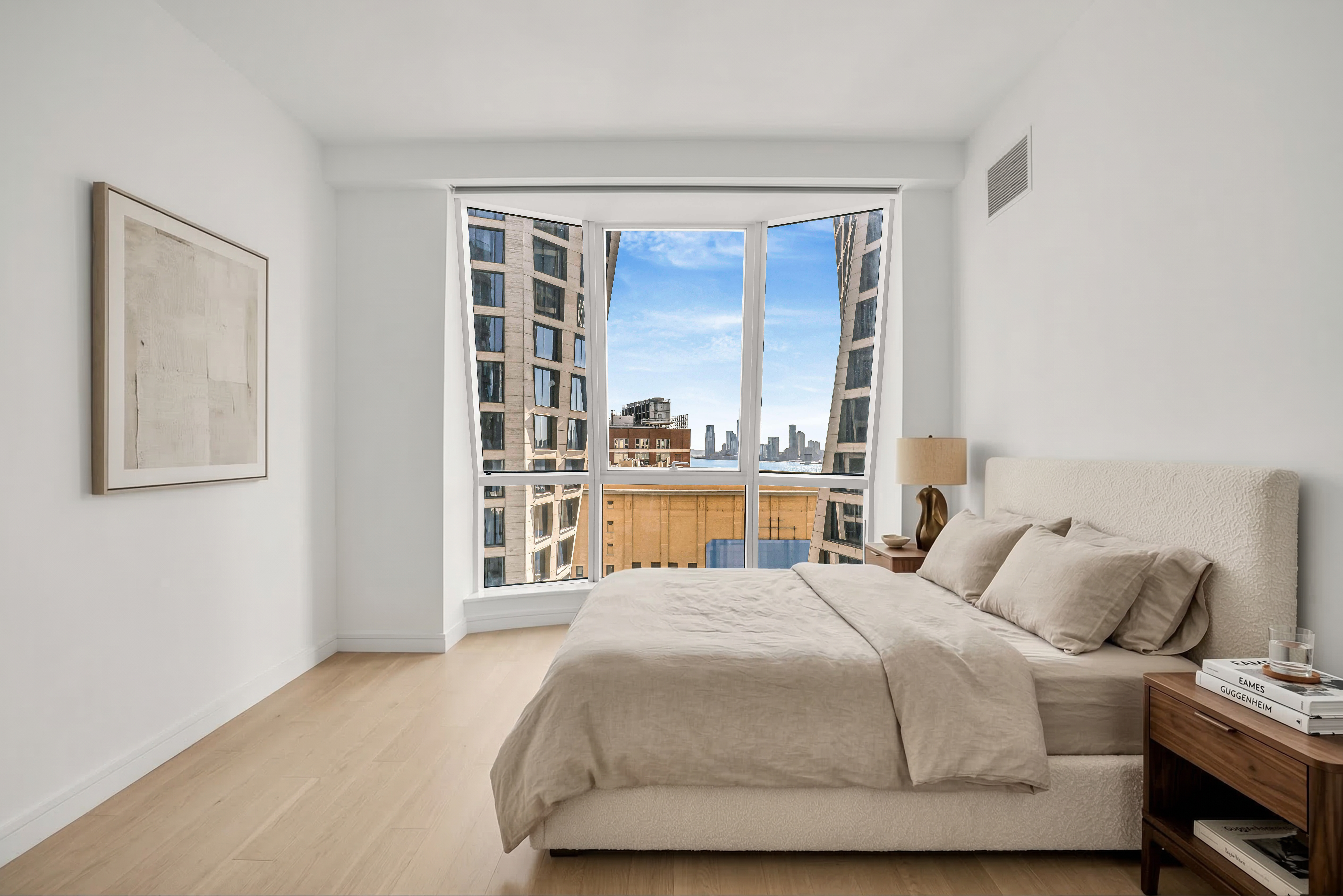 515 West 18th Street, Unit 1504 Manhattan, NY 10011 - Photo 6 of 11 a bedroom with a bed and a window