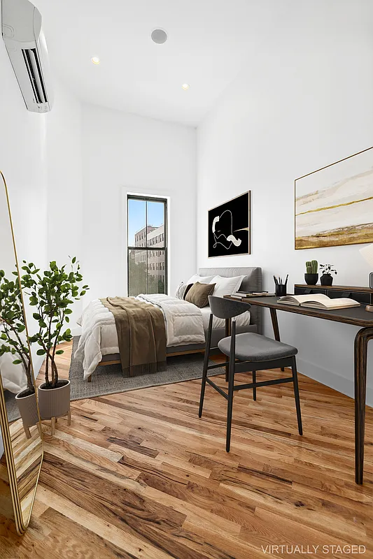 866 Bushwick Avenue, Unit 3 Brooklyn, NY 11221 - Photo 8 of 12 a bedroom with a bed and a potted plant