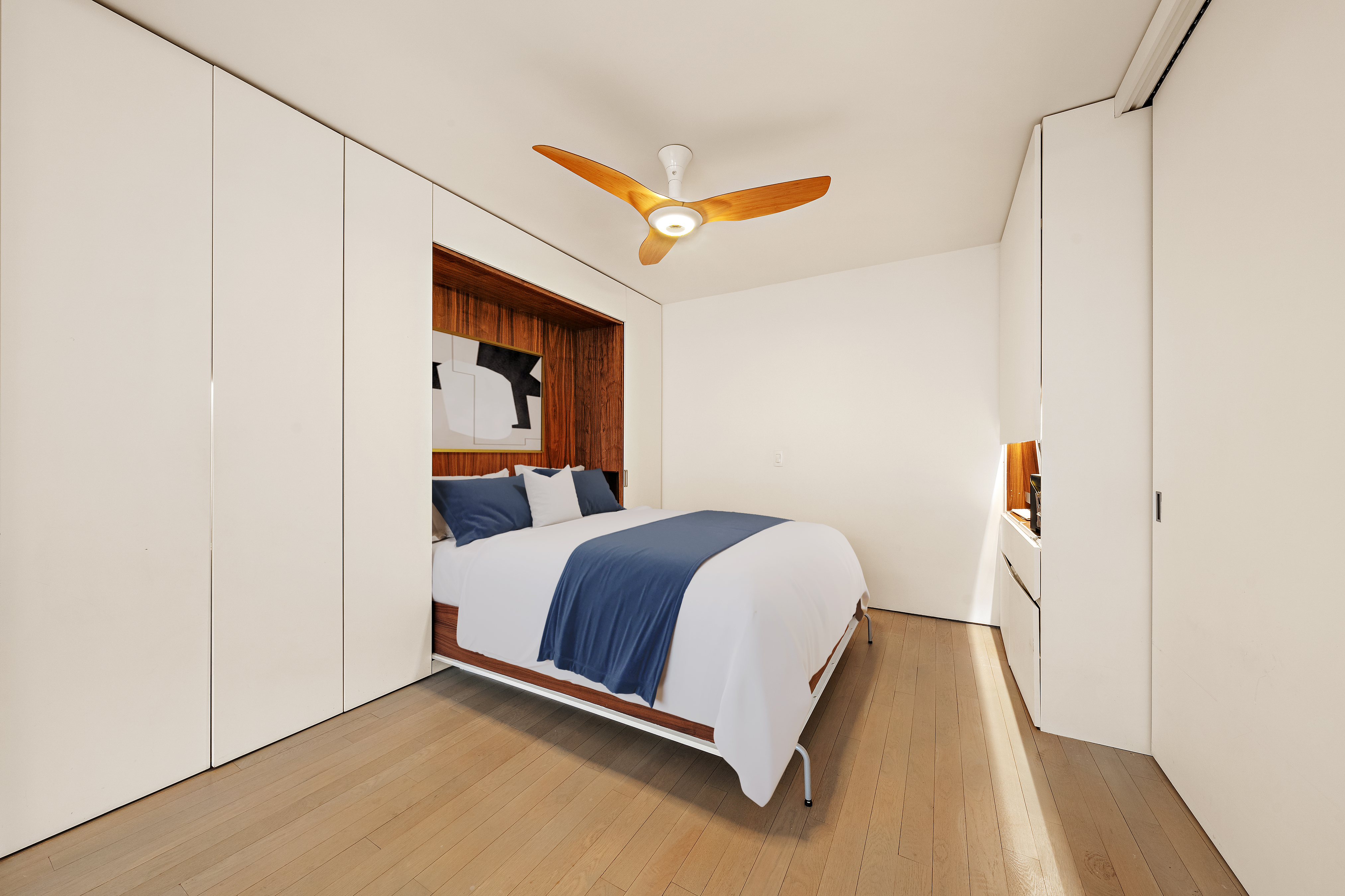 280 Rector Place, Unit 5IJ Manhattan, NY 10280 - Photo 7 of 10 a bed room with a bed and a ceiling fan