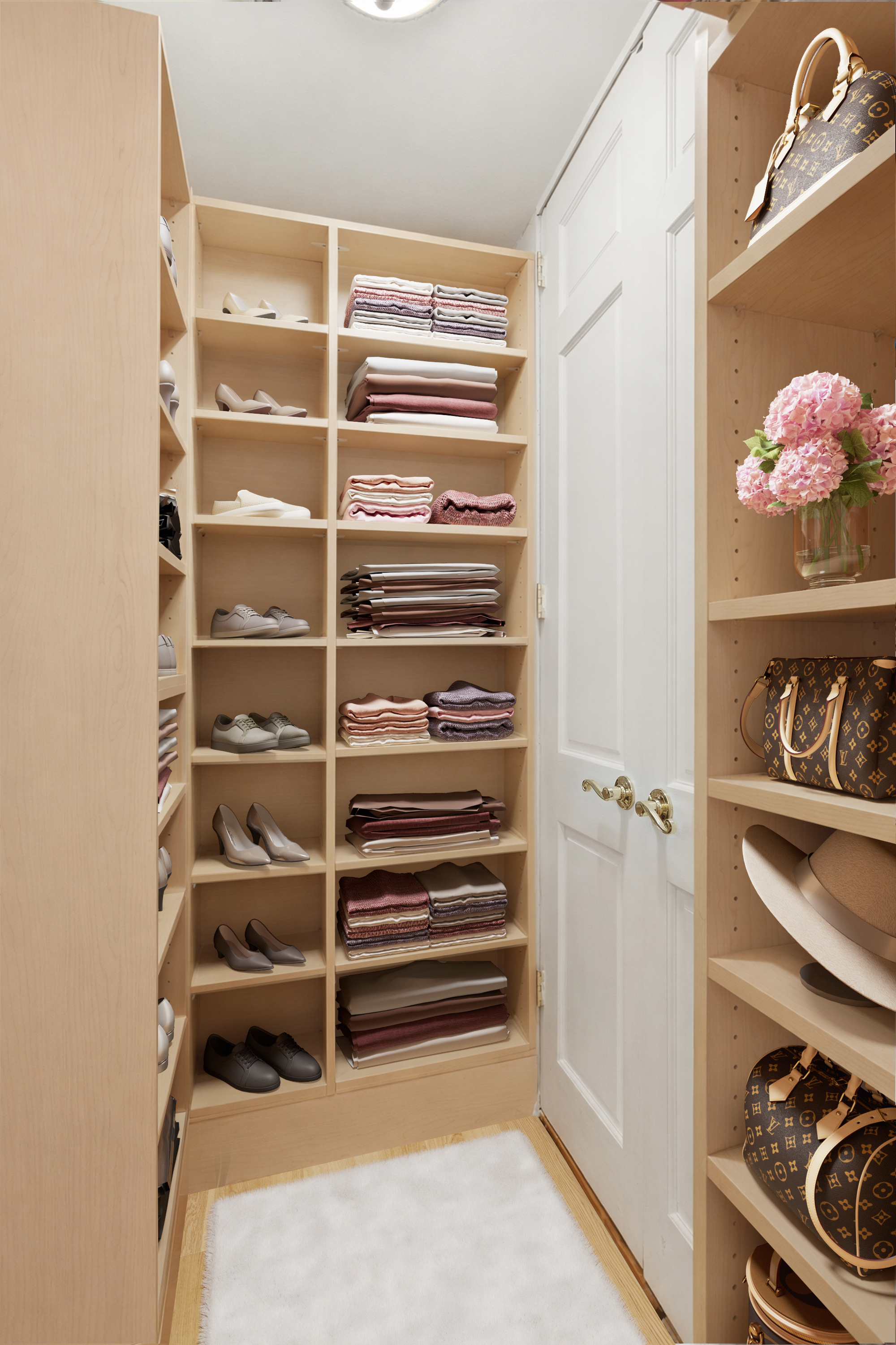 345 East 81st Street, Unit 12G Manhattan, NY 10028 - Photo 4 of 8 a view of walk in closet with clothes and shoes