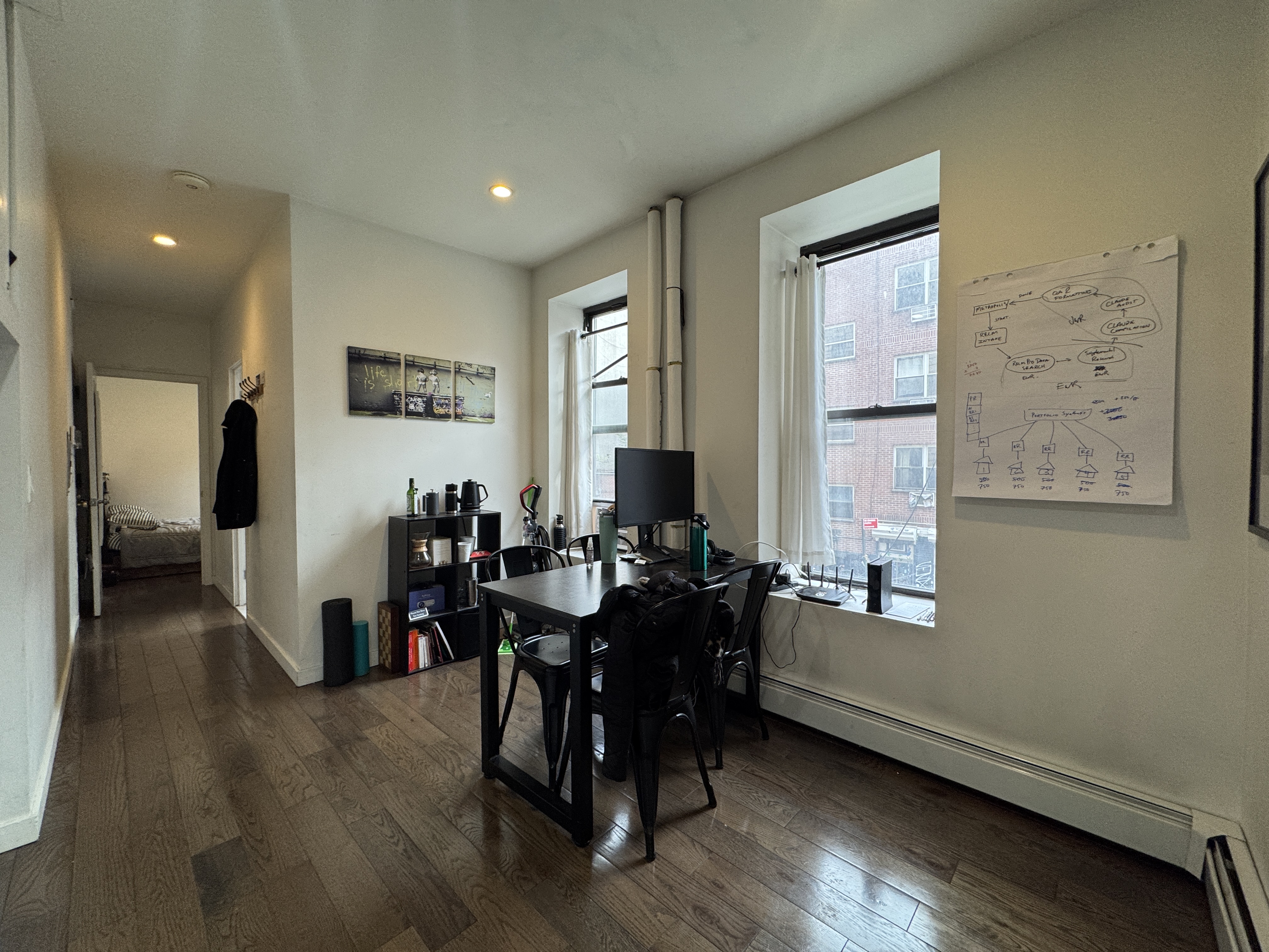 108 Stanton Street, Unit 1A Manhattan, NY 10002 - Photo 6 of 11 a view of a livingroom with furniture and a window