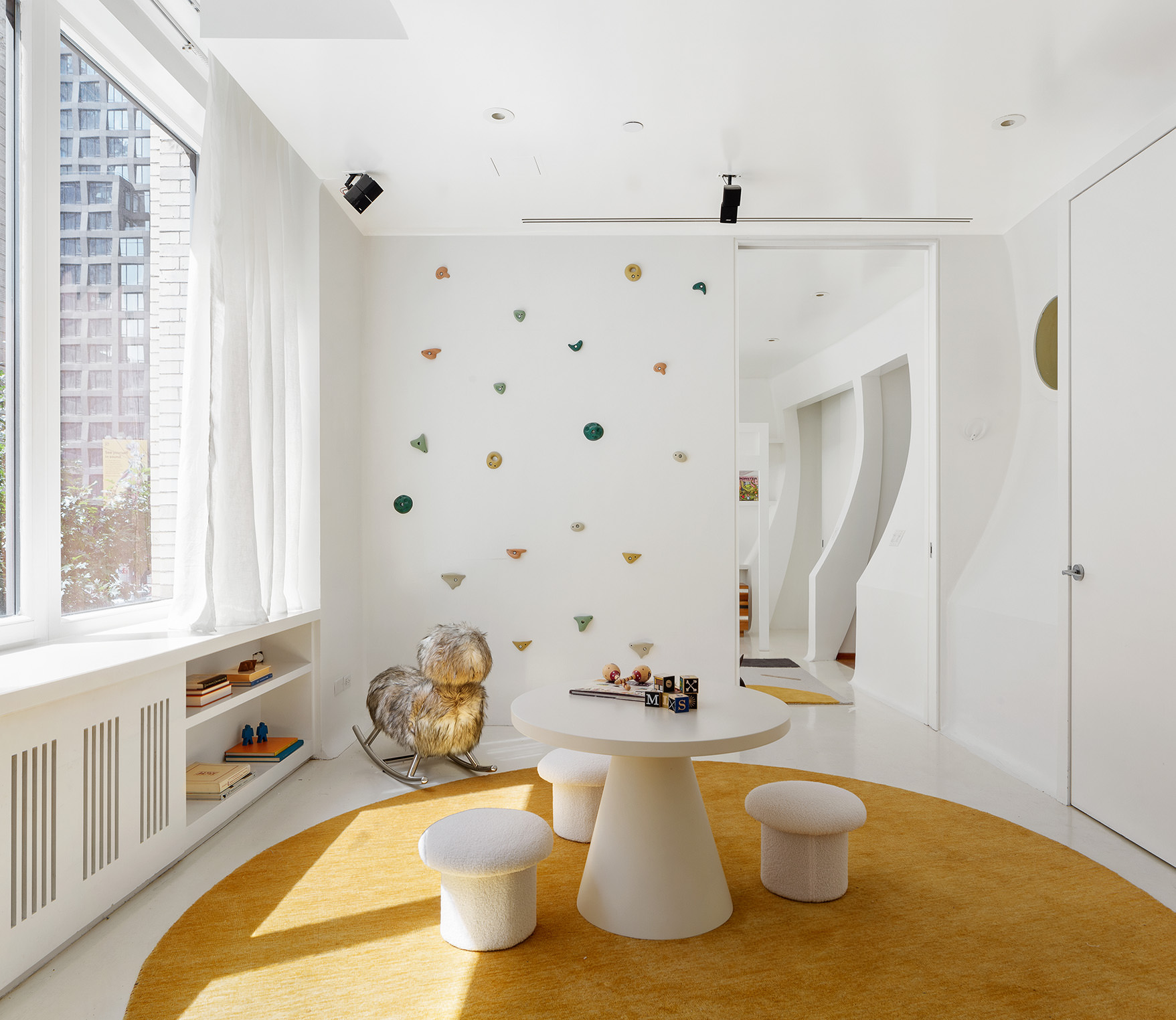 145 6th Avenue, Unit 2B Manhattan, NY 10013 - Photo 14 of 23 a living room with furniture and a window