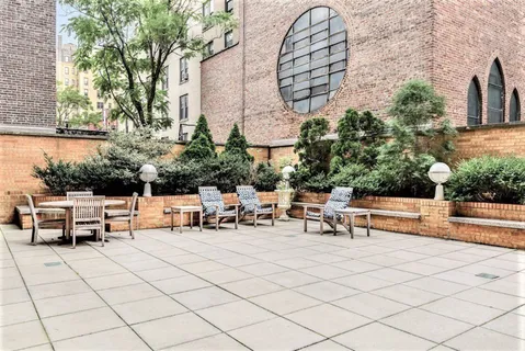 a view of a terrace with sitting area