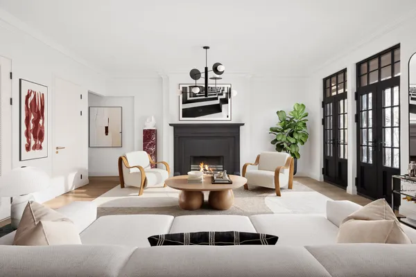 a living room with furniture a fireplace and potted plants