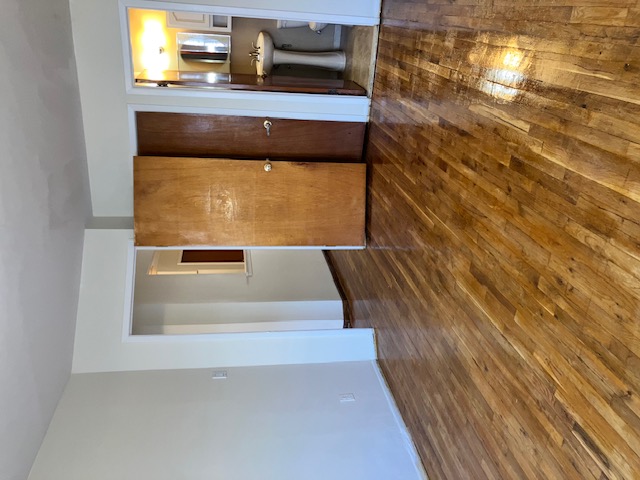 1653 West 9th Street, Unit 2 Brooklyn, NY 11223 - Photo 6 of 7 a view of a livingroom with wooden floor and kitchen space