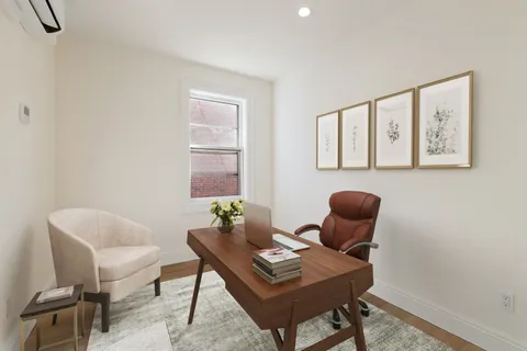 a work room with furniture and windows