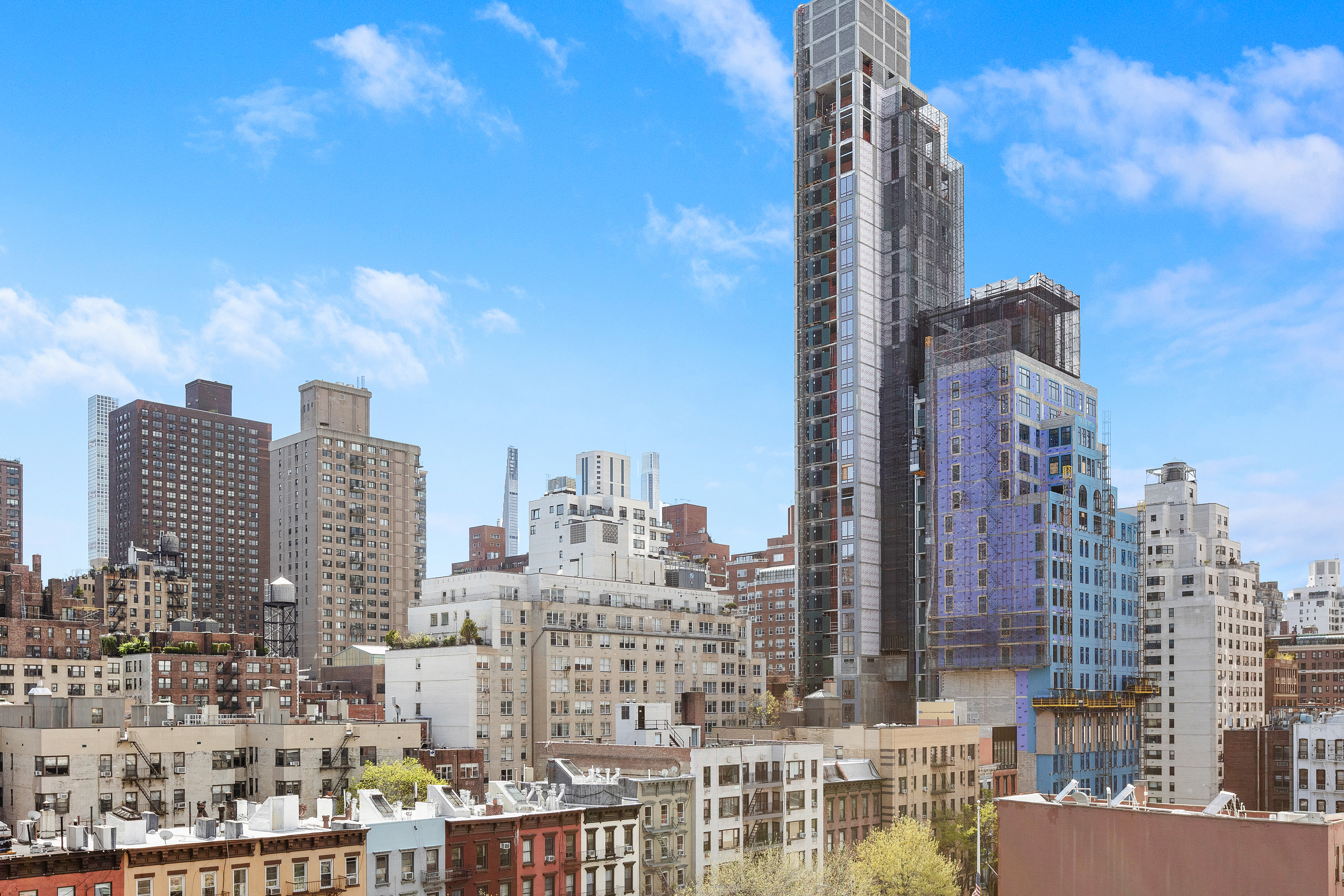 240 East 76th Street, Unit 9A Manhattan, NY 10021 - Photo 9 of 9 a city view with tall buildings