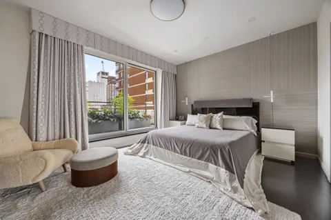 a bedroom with a bed and a couch