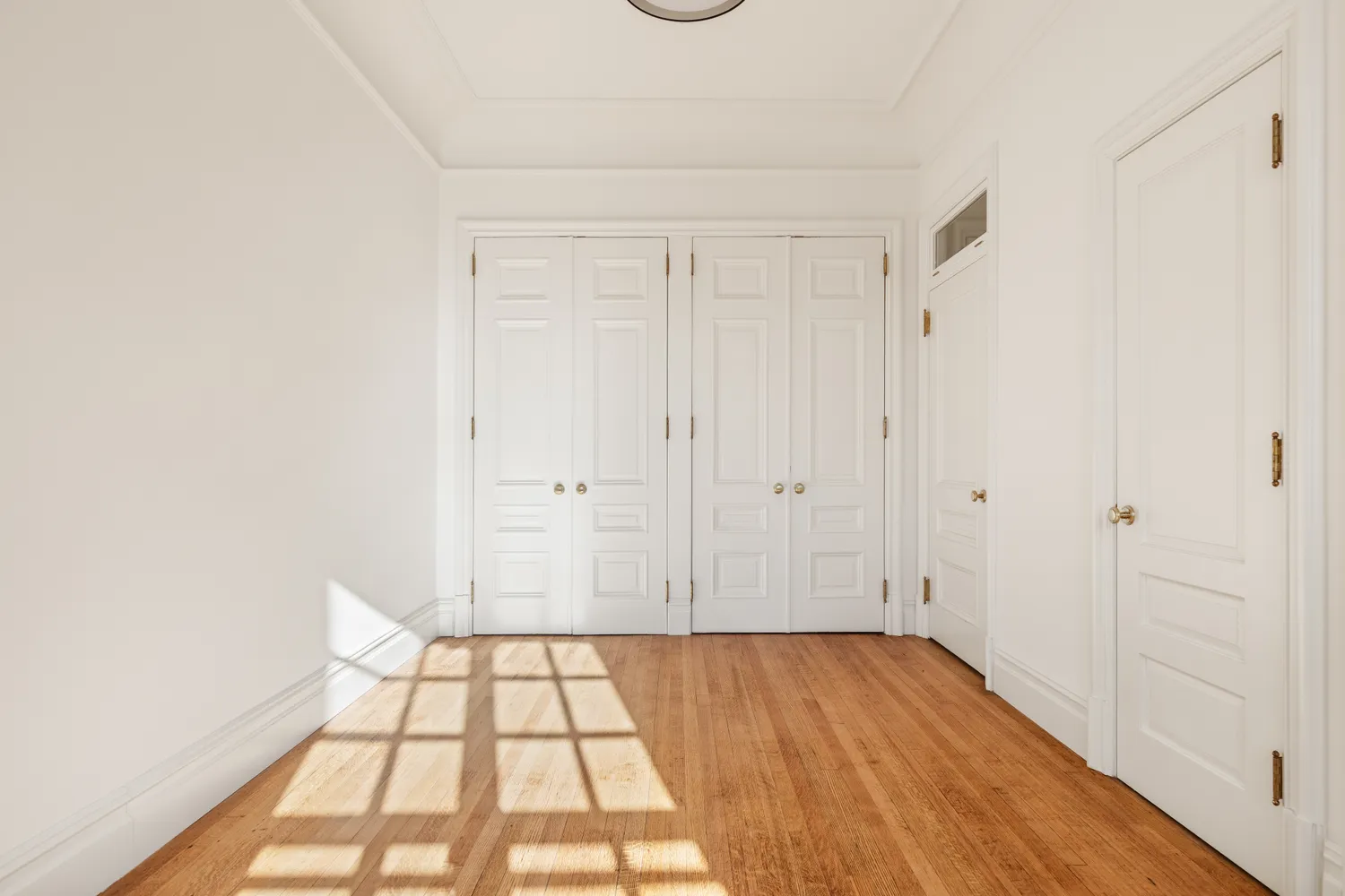 a view of an empty room and window