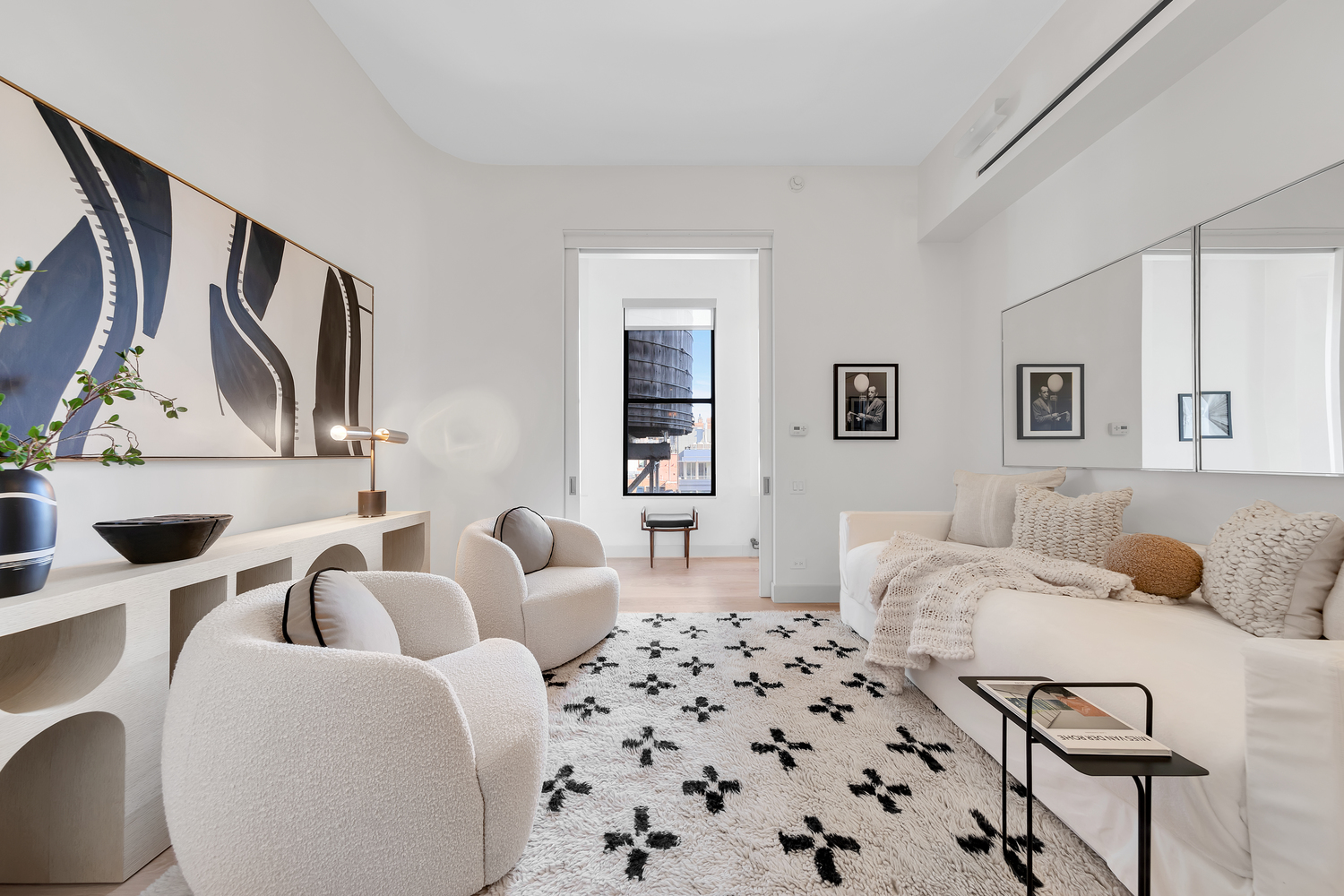38 Crosby Street, Unit 8 Manhattan, NY 10013 - Photo 12 of 27 a bedroom with a bed and wooden floor