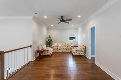 a bedroom with a bed and a night stand