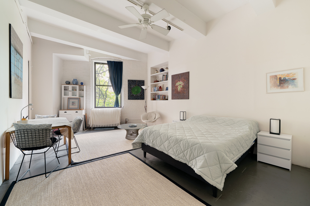 477 Washington Street Manhattan, NY 10013 - Photo 10 of 20 a bedroom with a bed and a couch