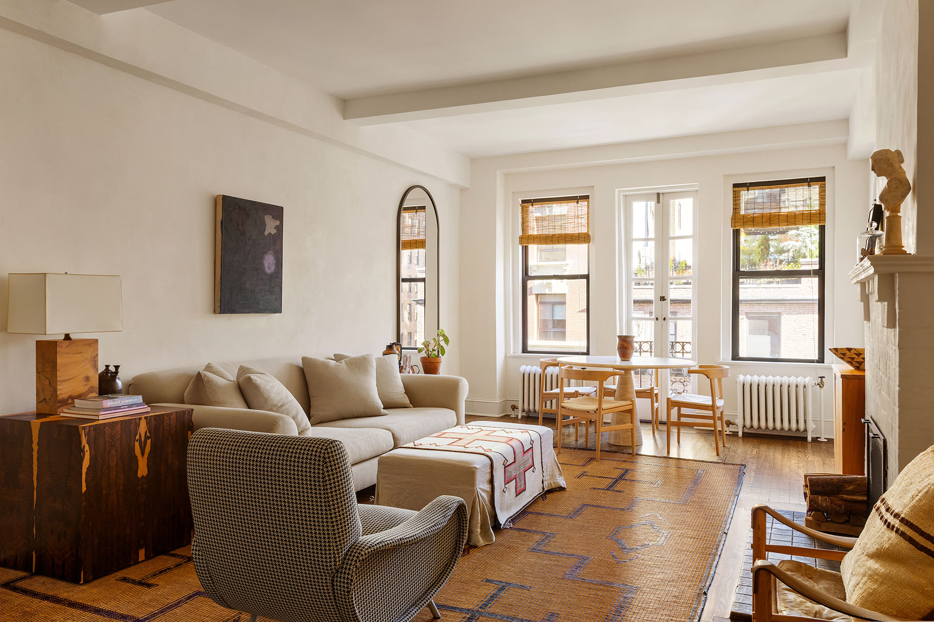 a living room with furniture and large windows