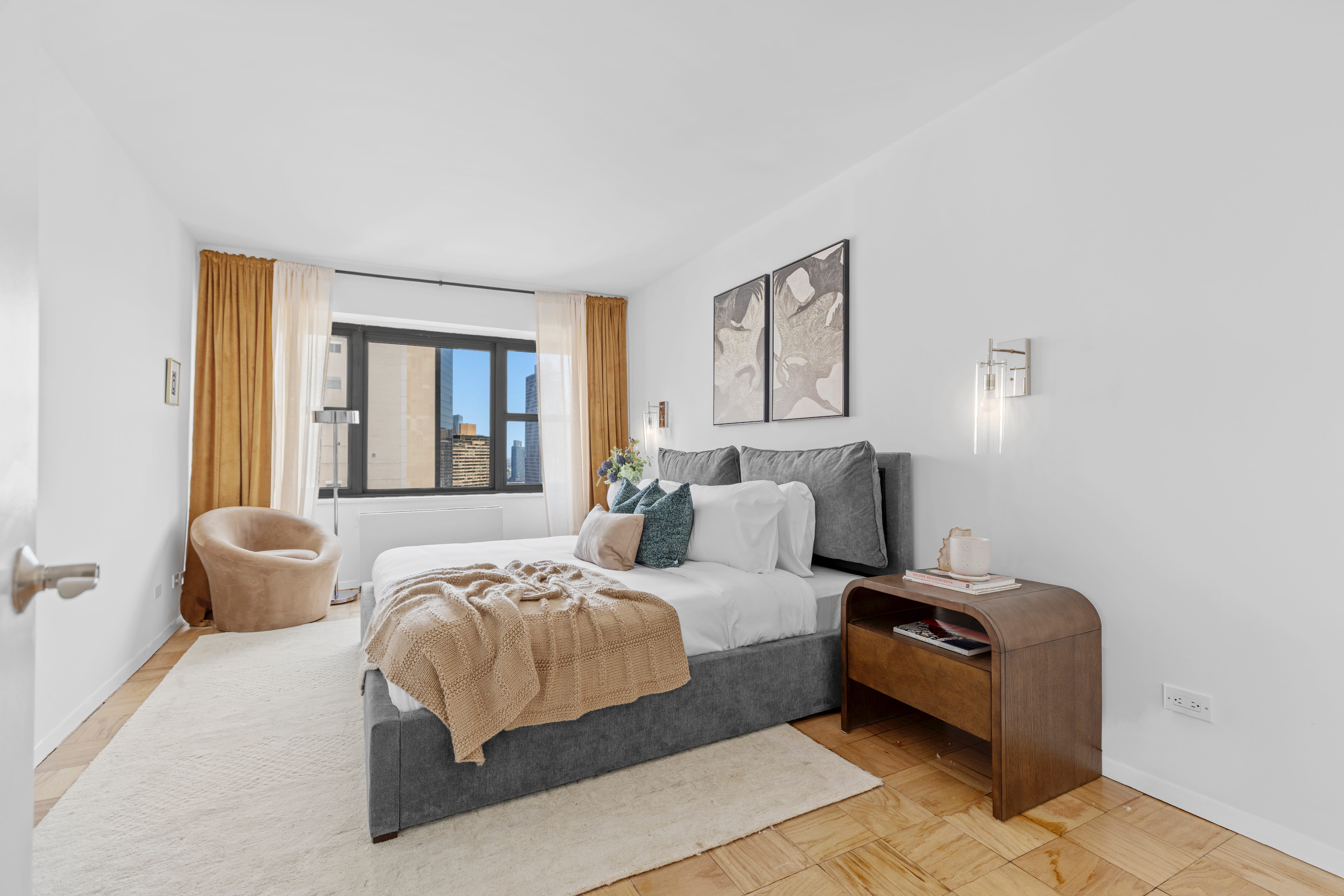 160 East 38th Street, Unit 26FG Manhattan, NY 10016 - Photo 8 of 23 a bedroom with a bed and wooden floor
