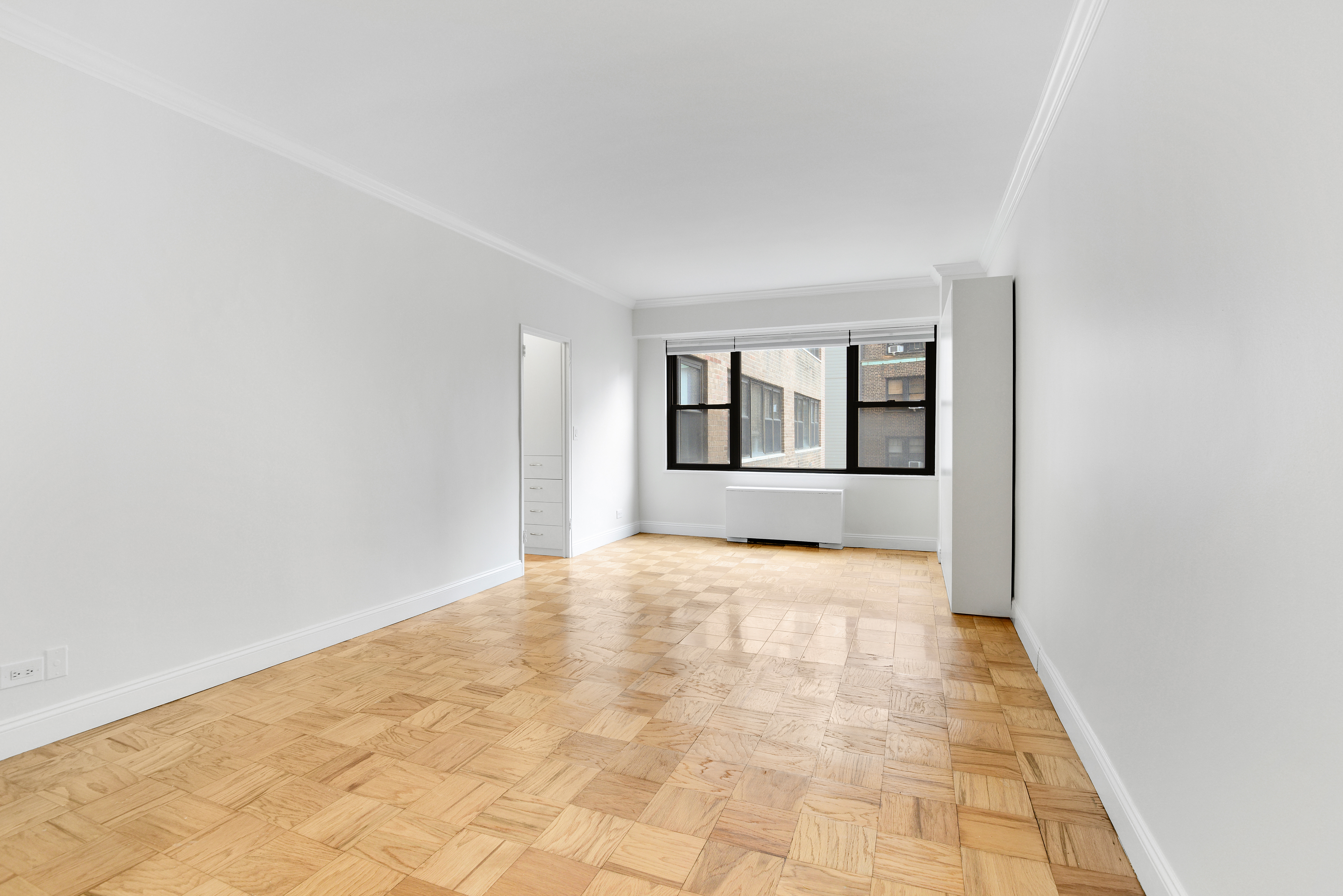 305 East 40th Street, Unit 14V Manhattan, NY 10016 - Photo 4 of 26 a view of an empty room with a window